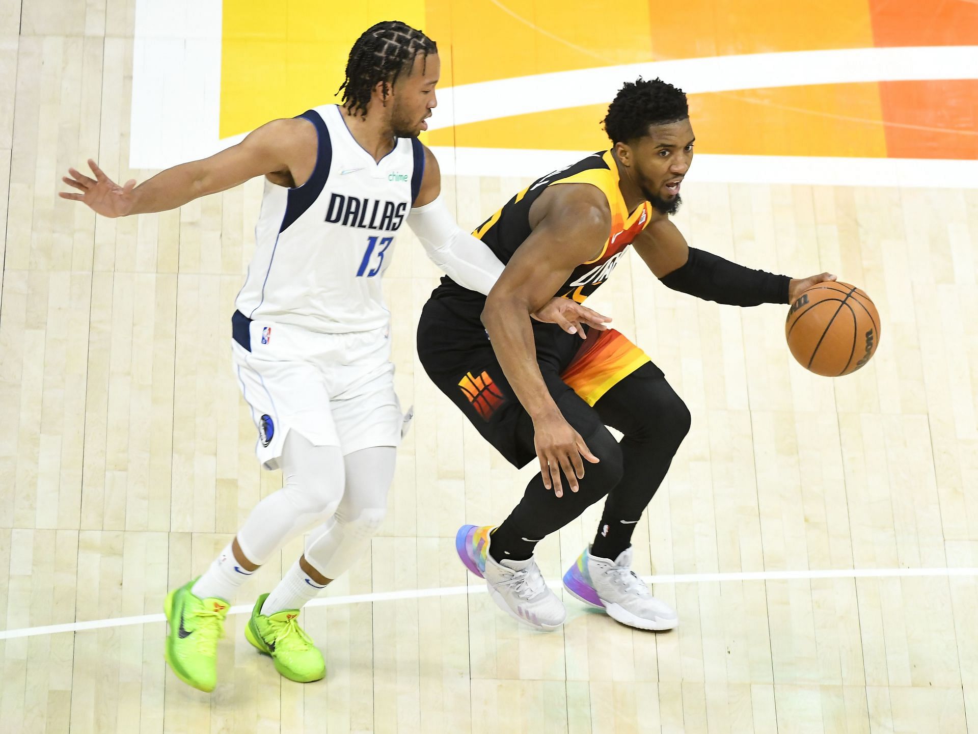 Donovan Mitchel of the Utah Jazz (right) in action during a 2022 NBA Playoffs game against the Dallas Mavericks