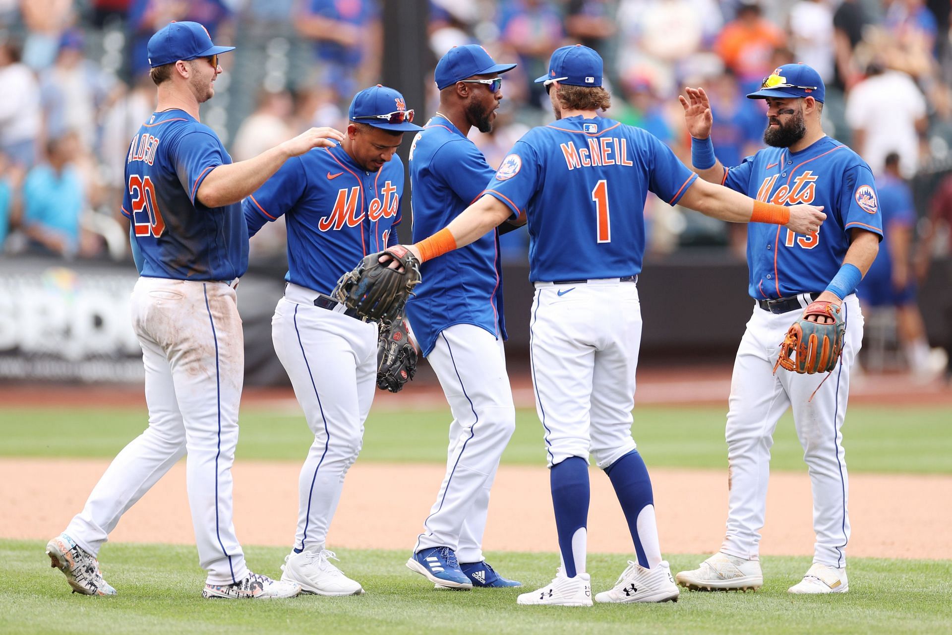 MLB: New York Mets players celebrate their victory over the Cincinnati Reds. The Mets won convincingly by a score of 10-2.