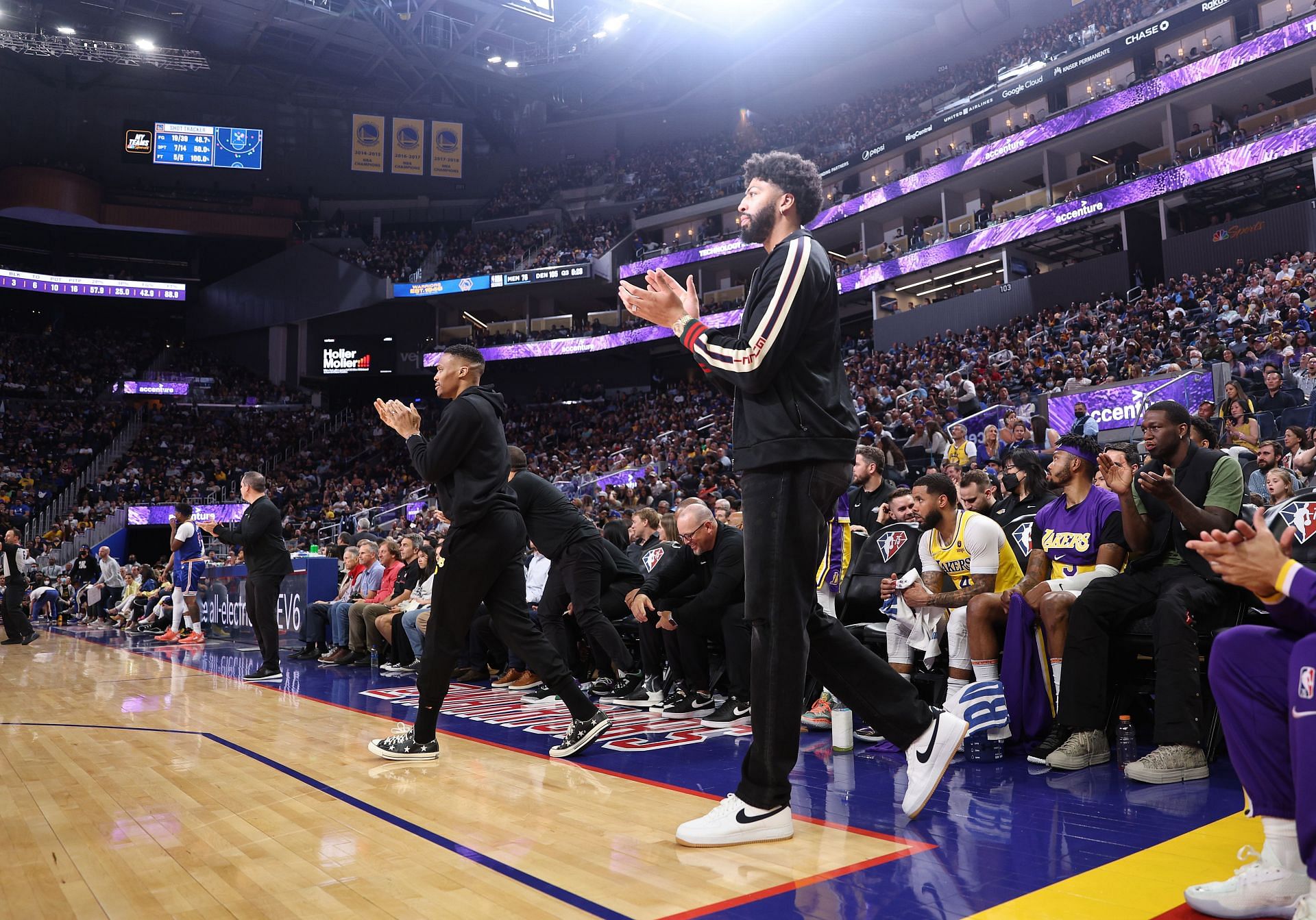 Anthony Davis celebrates a play from the bench