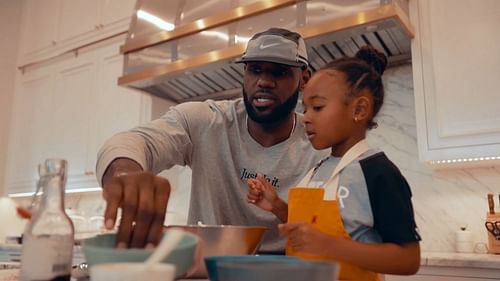 LBJ baking cupcakes with his daughter Zhuri