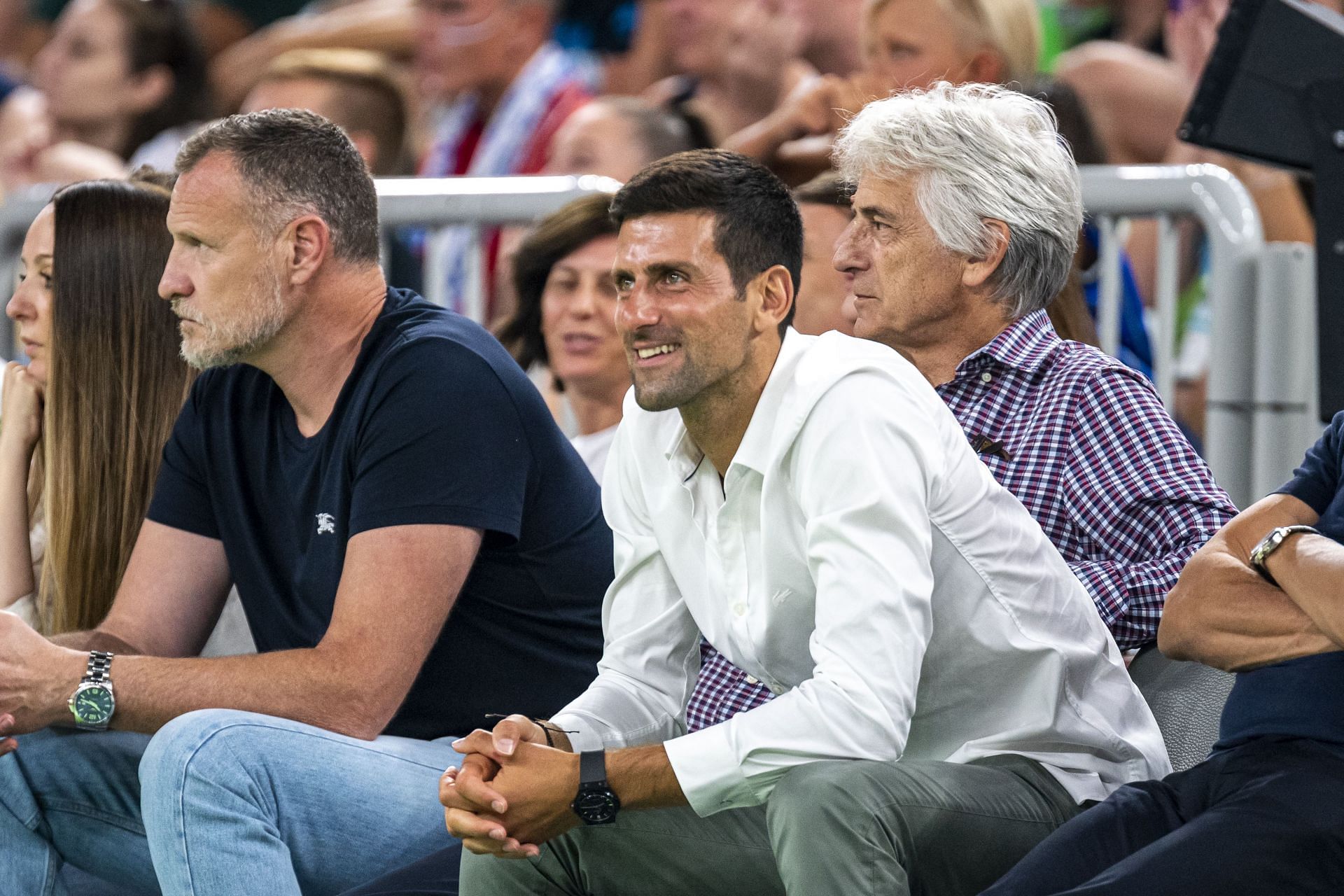 Tennis ace Novak Djokovic enjoys at a basketball match. (Pic: Getty Images)