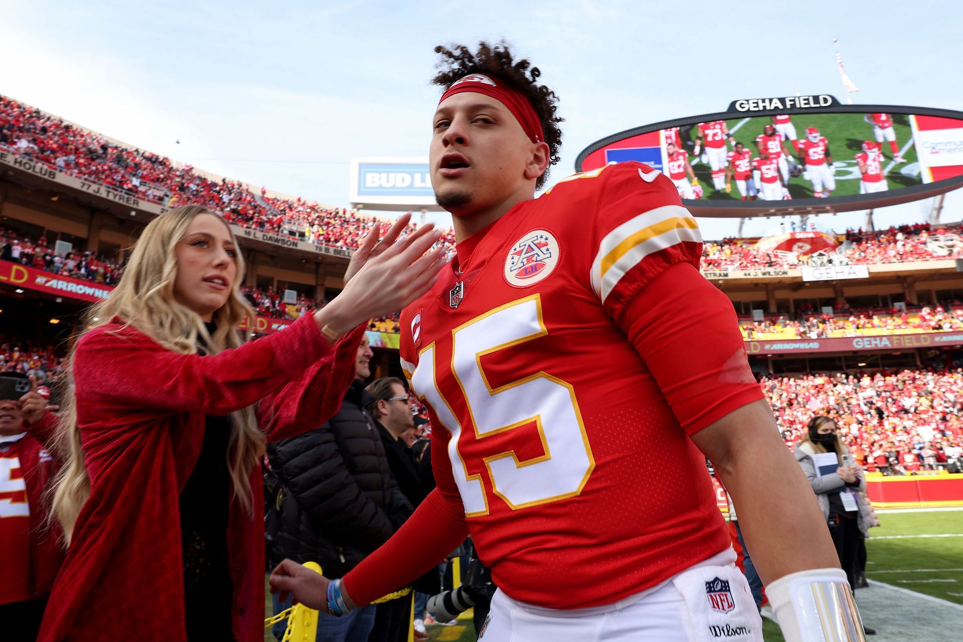 Brittany Matthews sprays champagne during Chiefs playoff win