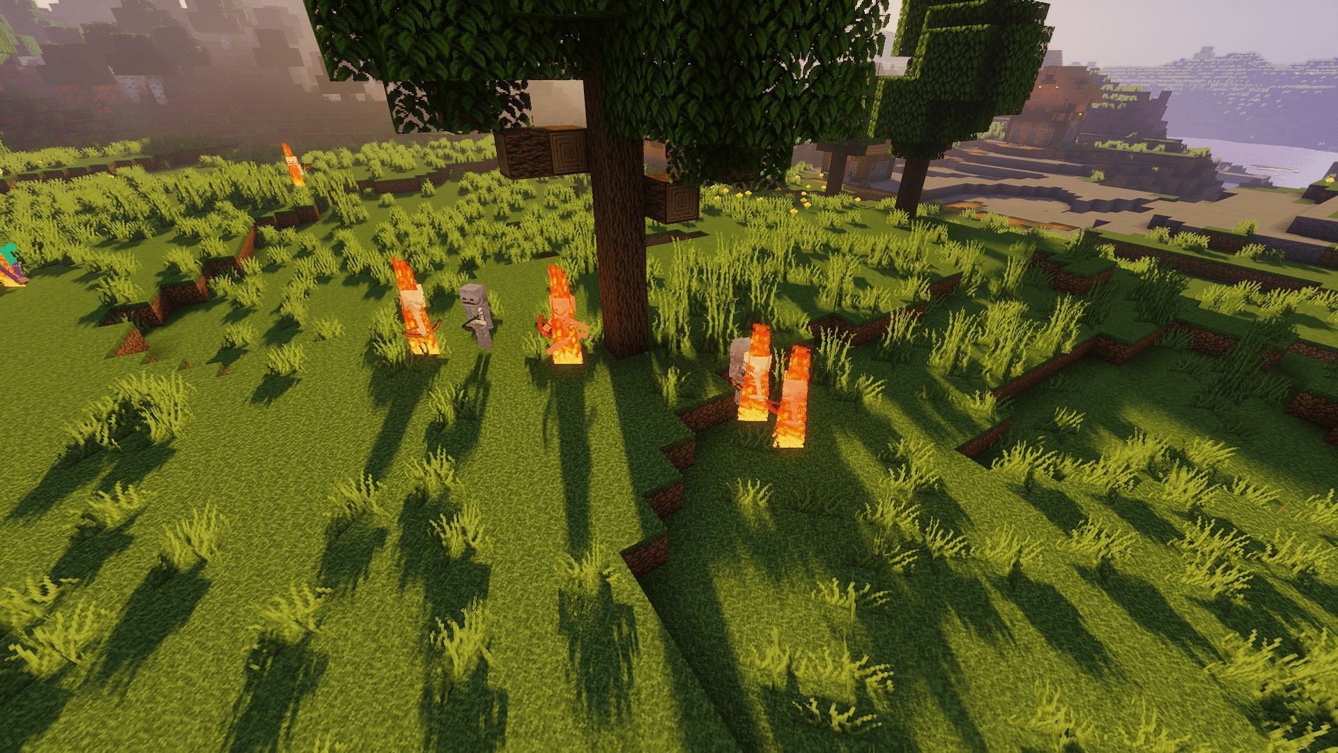 Mobs burning in the light of early morning (Image via Minecraft)