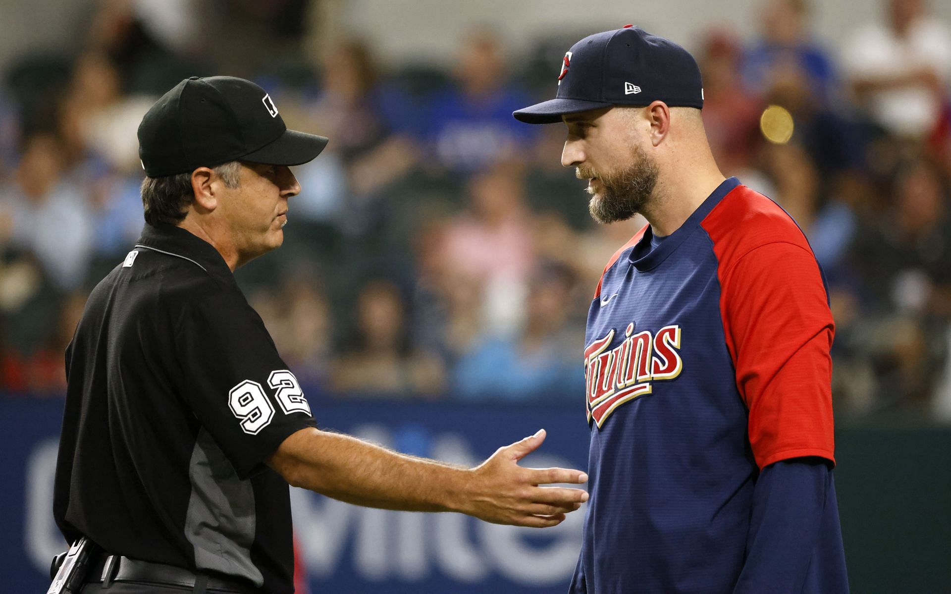 Manager Rocco Baldelli of the Minnesota Twins talks with the umpire during a game in Arlington, Texas.