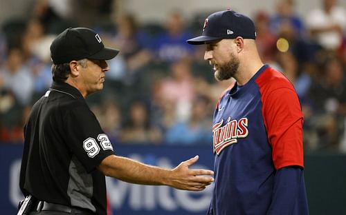 Manager Rocco Baldelli of the Minnesota Twins talks with the umpire during a game in Arlington, Texas.