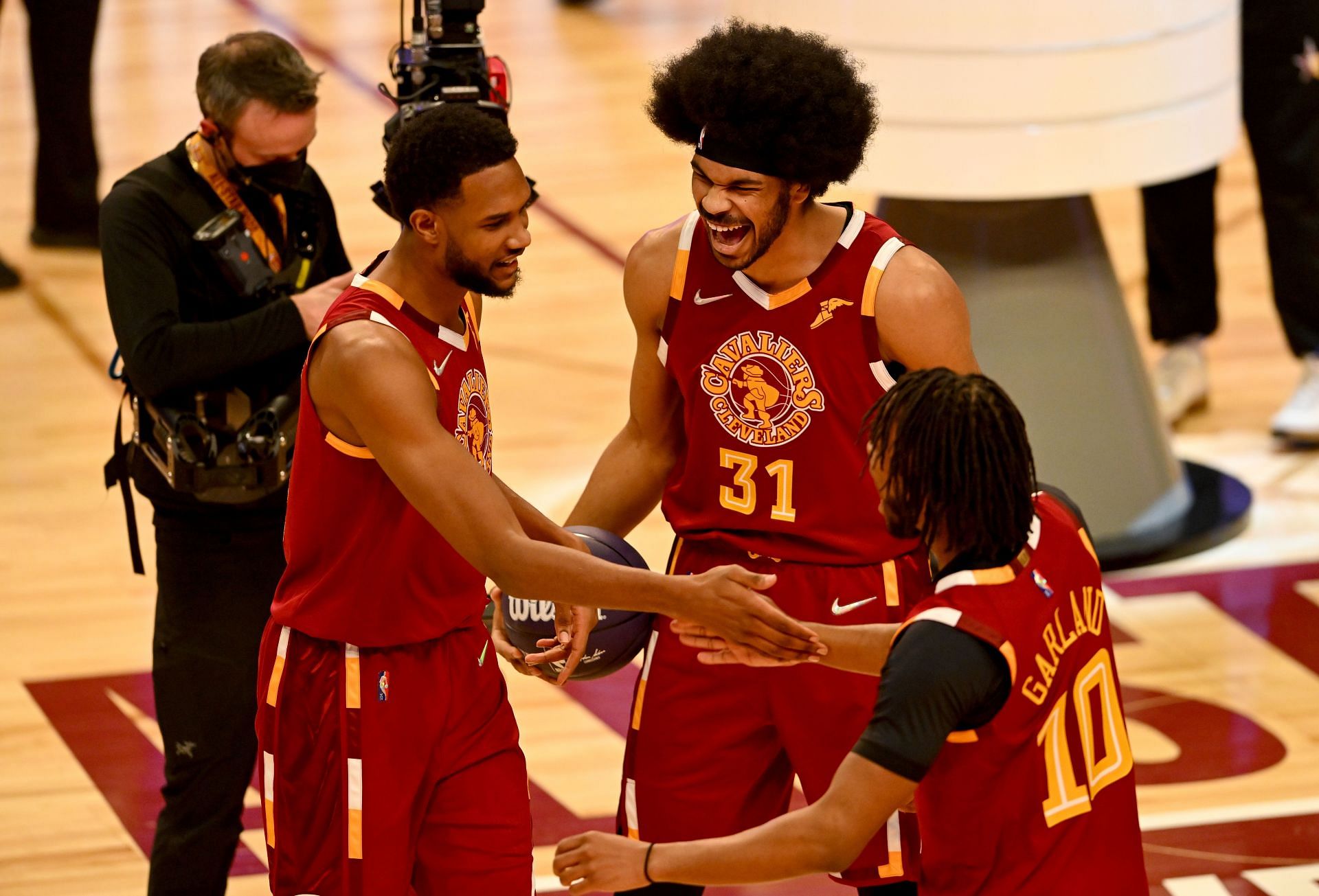 Evan Mobley, Jarrett Allen and Darius Garland of the Cleveland Cavaliers