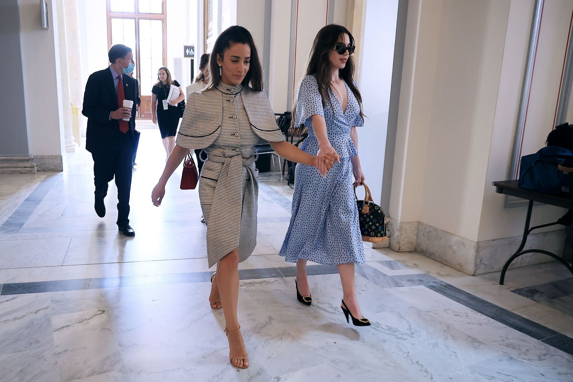 Aly Raisman and Mckayla Maroney are pictured at a bipartisan senators&#039; news conference on the FBI&#039;s handling of the Nassar Case (Image via Getty)