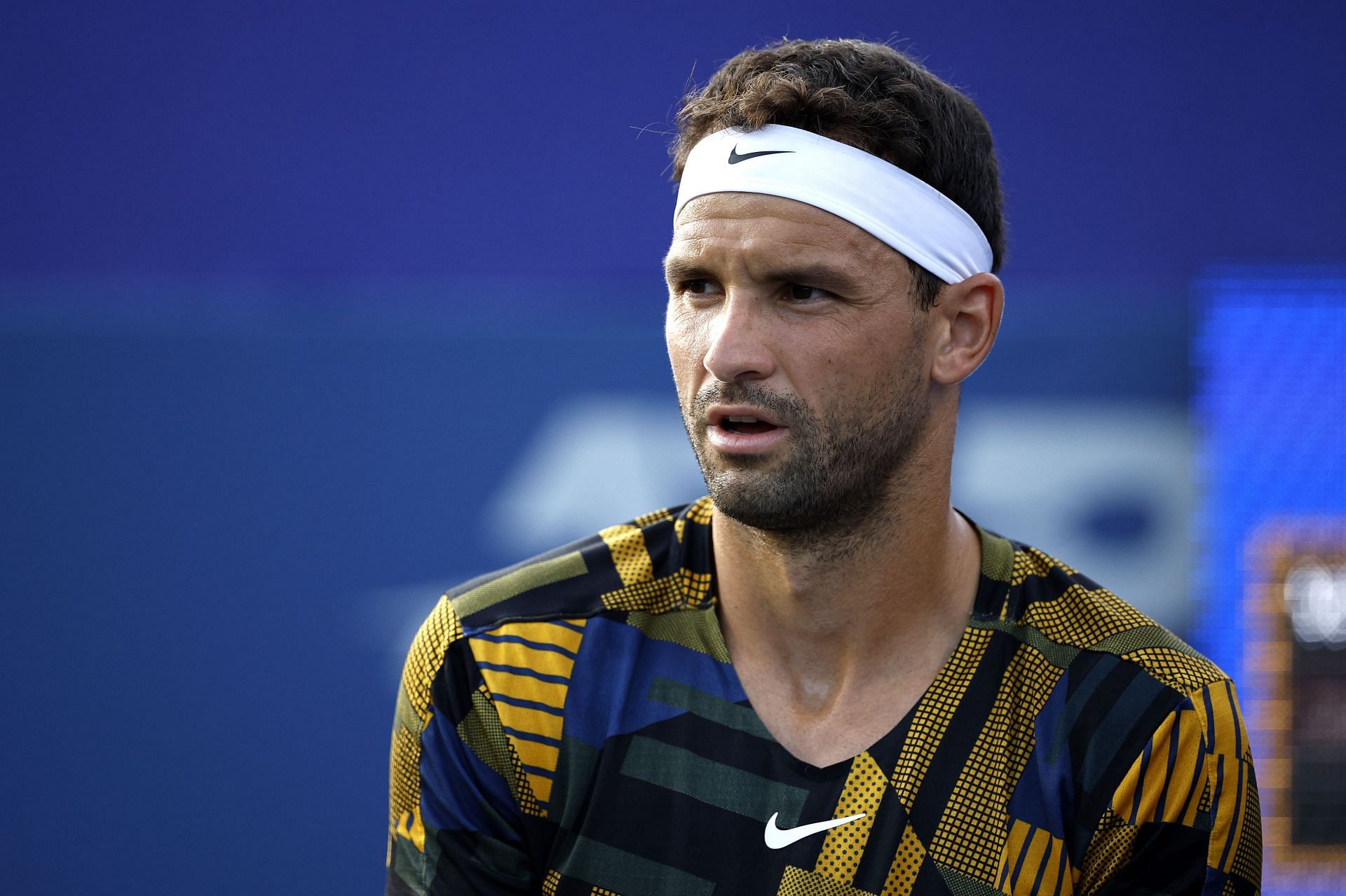 Grigor Dimitrov looks on during his second-round match at the Winston-Salem Open