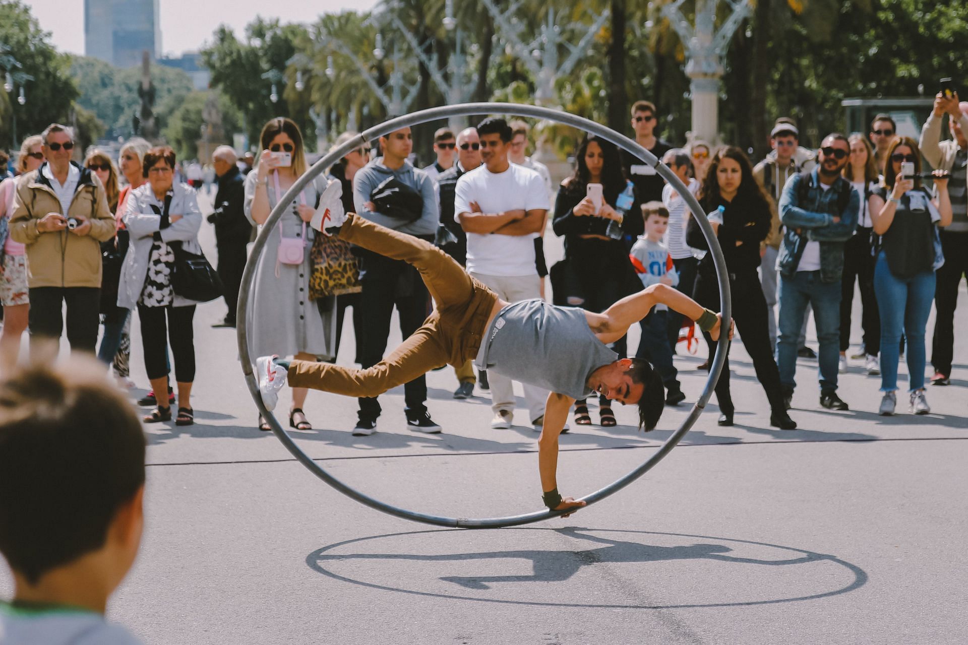 A weighted hula hoop can increase resistance and make your workout harder. (Image via Unsplash/Kristijan Arsov)