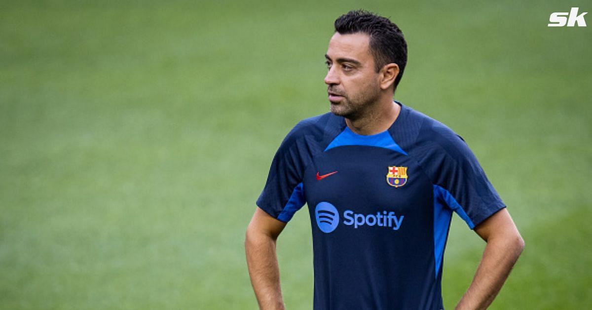 Blaugrana manager Xavi Hernandez looks on.