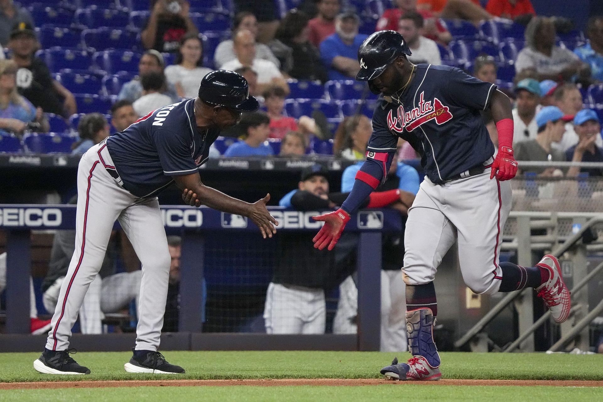 Michael Harris rounds third after a ninth-inning home run against the Miami Marlins.