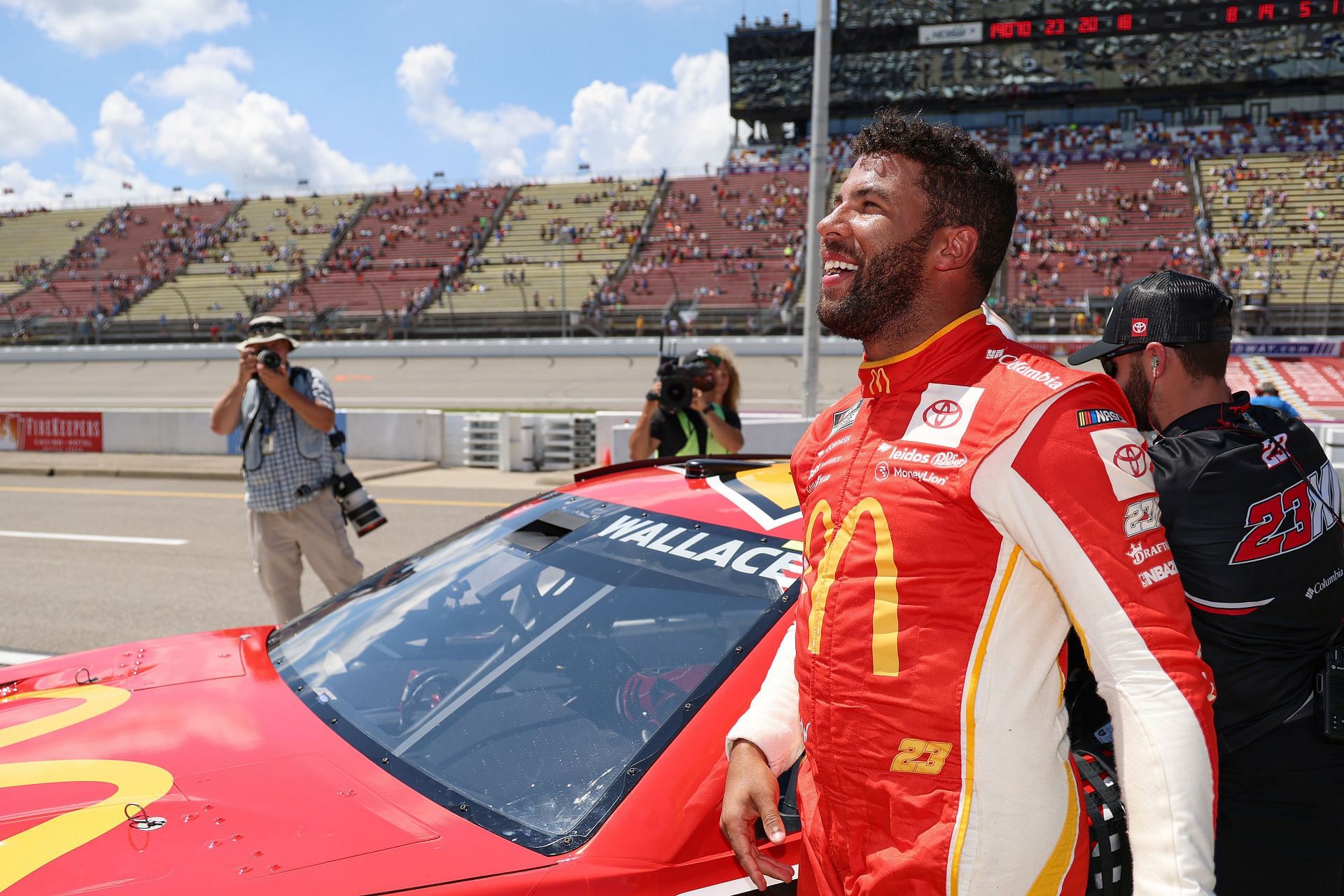 Bubba Wallace Jr. celebrates after winning the pole award for the 2022 NASCAR Cup Series FireKeepers Casino 400 at Michigan International Speedway in Brooklyn, Michigan (Photo by Mike Mulholland/Getty Images)