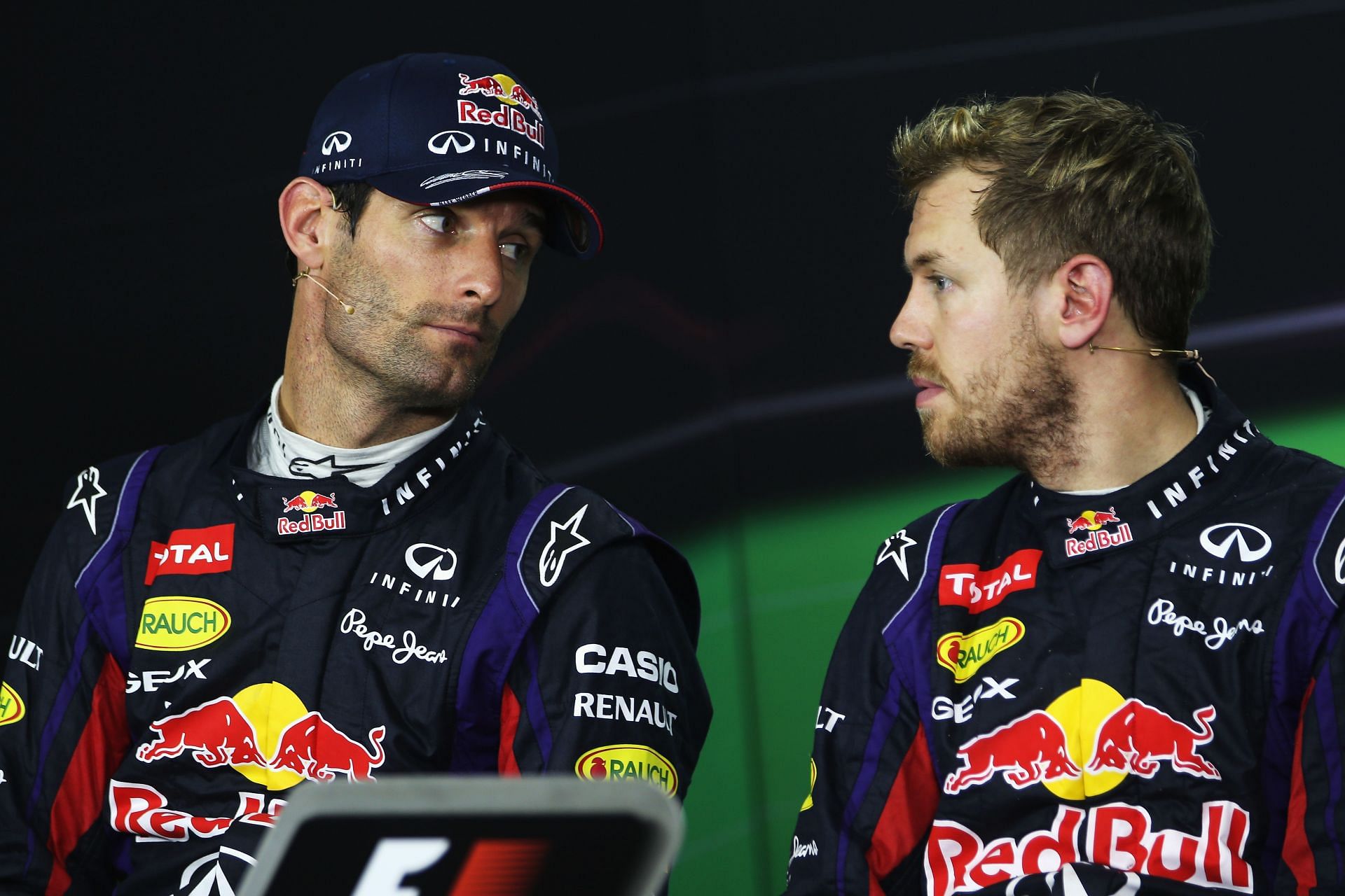 Mark Webber (left) and Sebastian Vettel (right) share a moment as Red Bull teammates during the 2010 F1 Brazilian GP. (Photo by Mark Thompson/Getty Images)