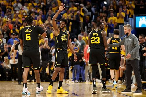 Kevon Looney, Andrew Wiggins, Draymond Green and Steve Kerr of the Golden State Warriors