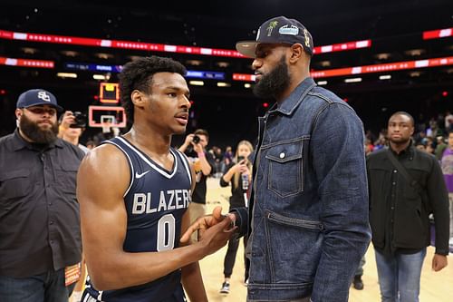 Bronny James #0 of the Sierra Canyon Trailblazers is greeted by his father and NBA player LeBron James after defeating the the Perry Pumas in the Hoophall West tournament at Footprint Center on December 11, 2021 in Phoenix, Arizona.