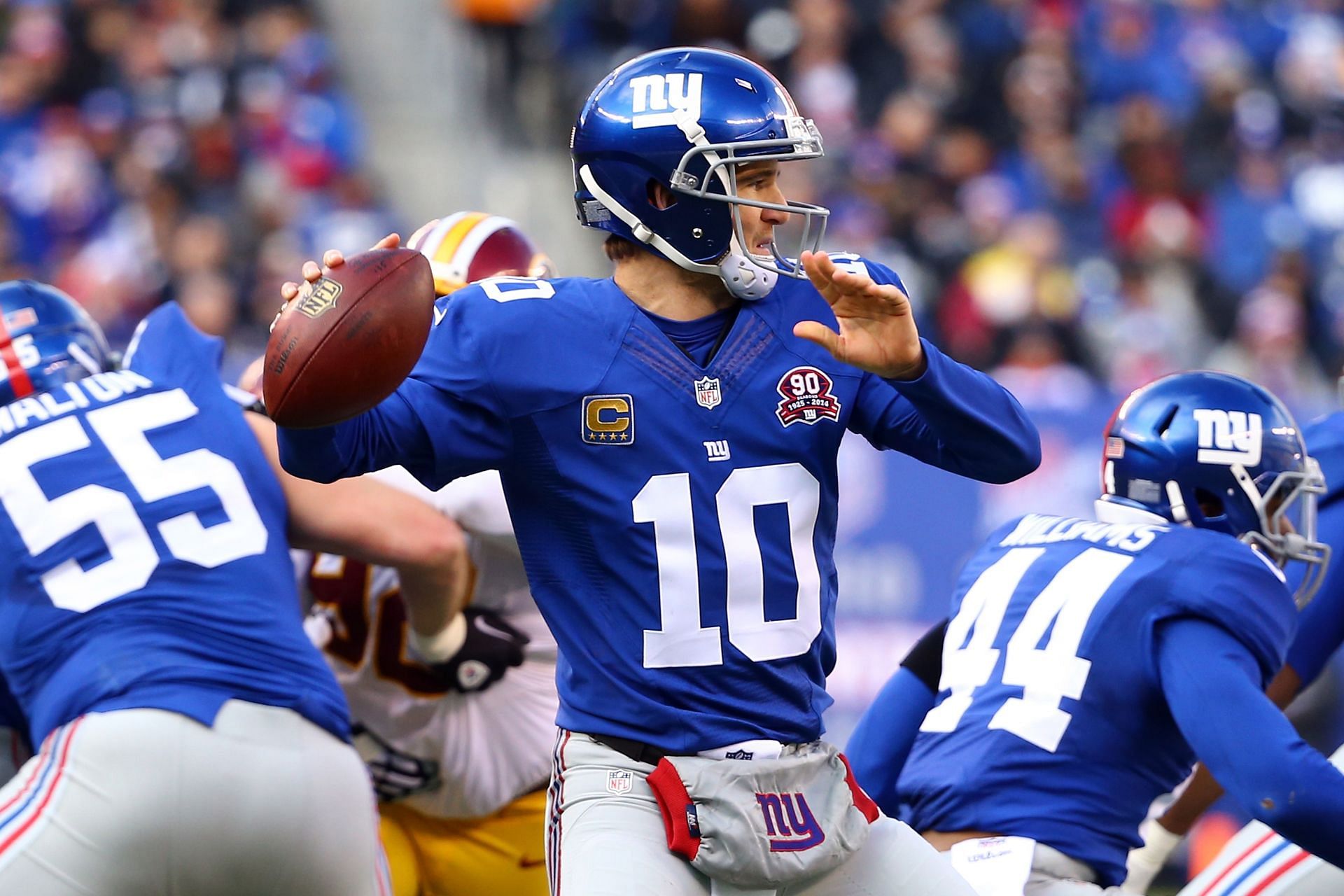 Former New York Giants quarterback Eli Manning pulls back to pass