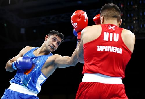 Boxing - Commonwealth Games: Day 4 Ashish Kumar Chaudhary in action