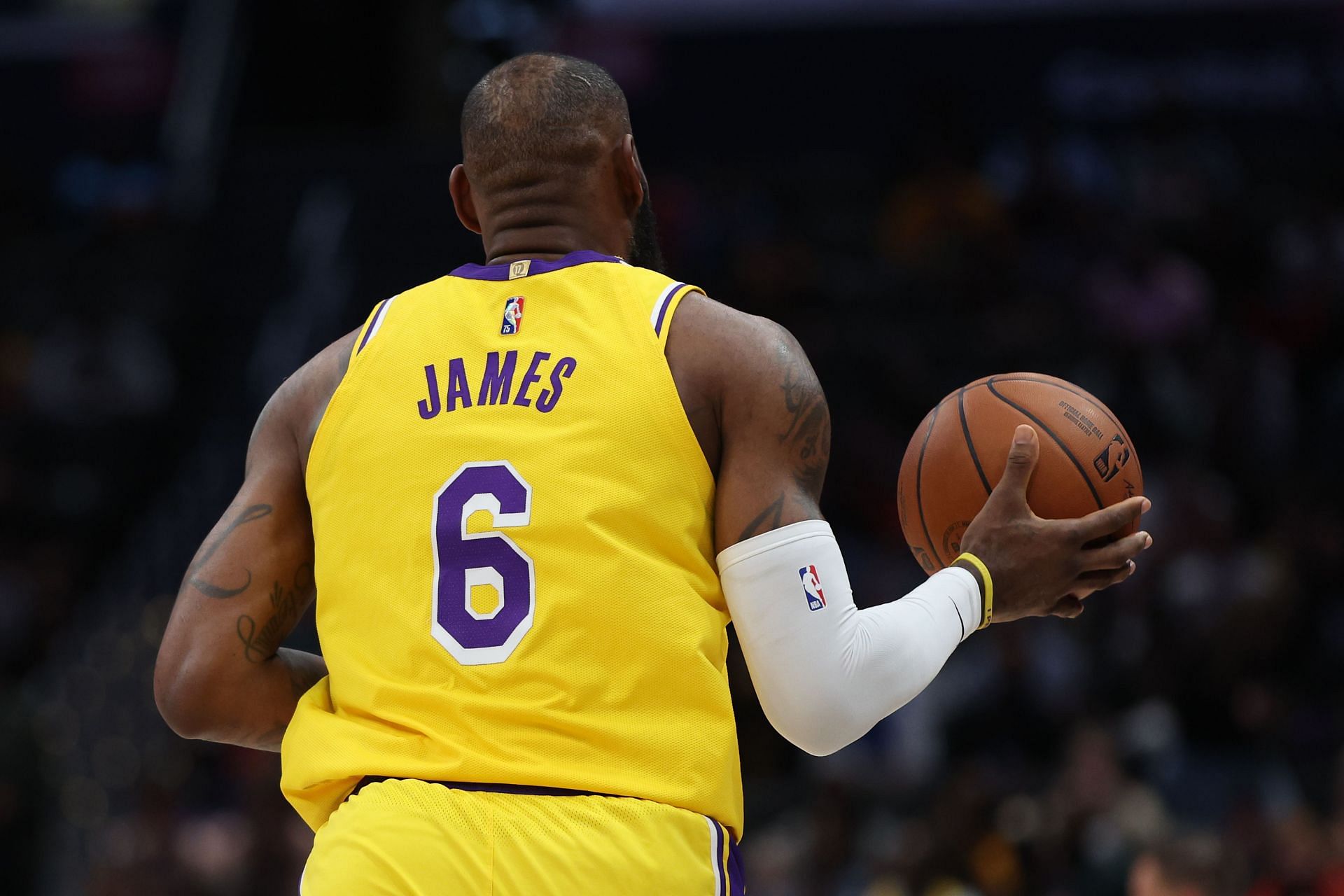 LeBron James brings the ball up the court.