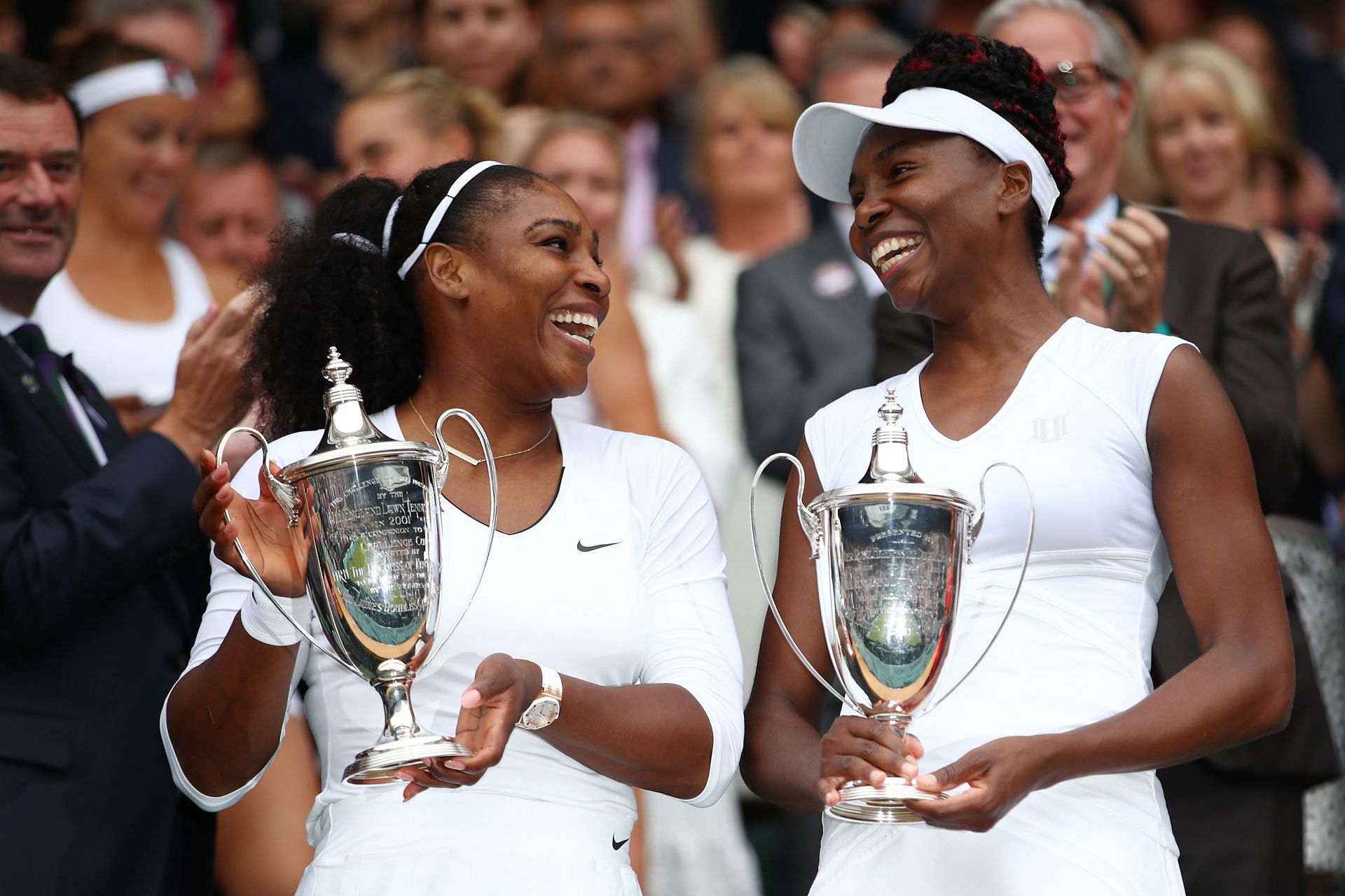 Serena Williams and Venus Williams with their 14th Grand Slam doubles trophies in Wimbledon 2016.