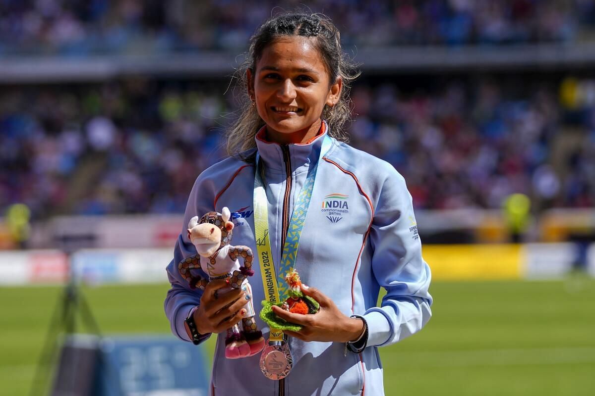 Priyanka Goswami, with the Lord Krishna idol, after winning the silver medal. (PC: Twitter)