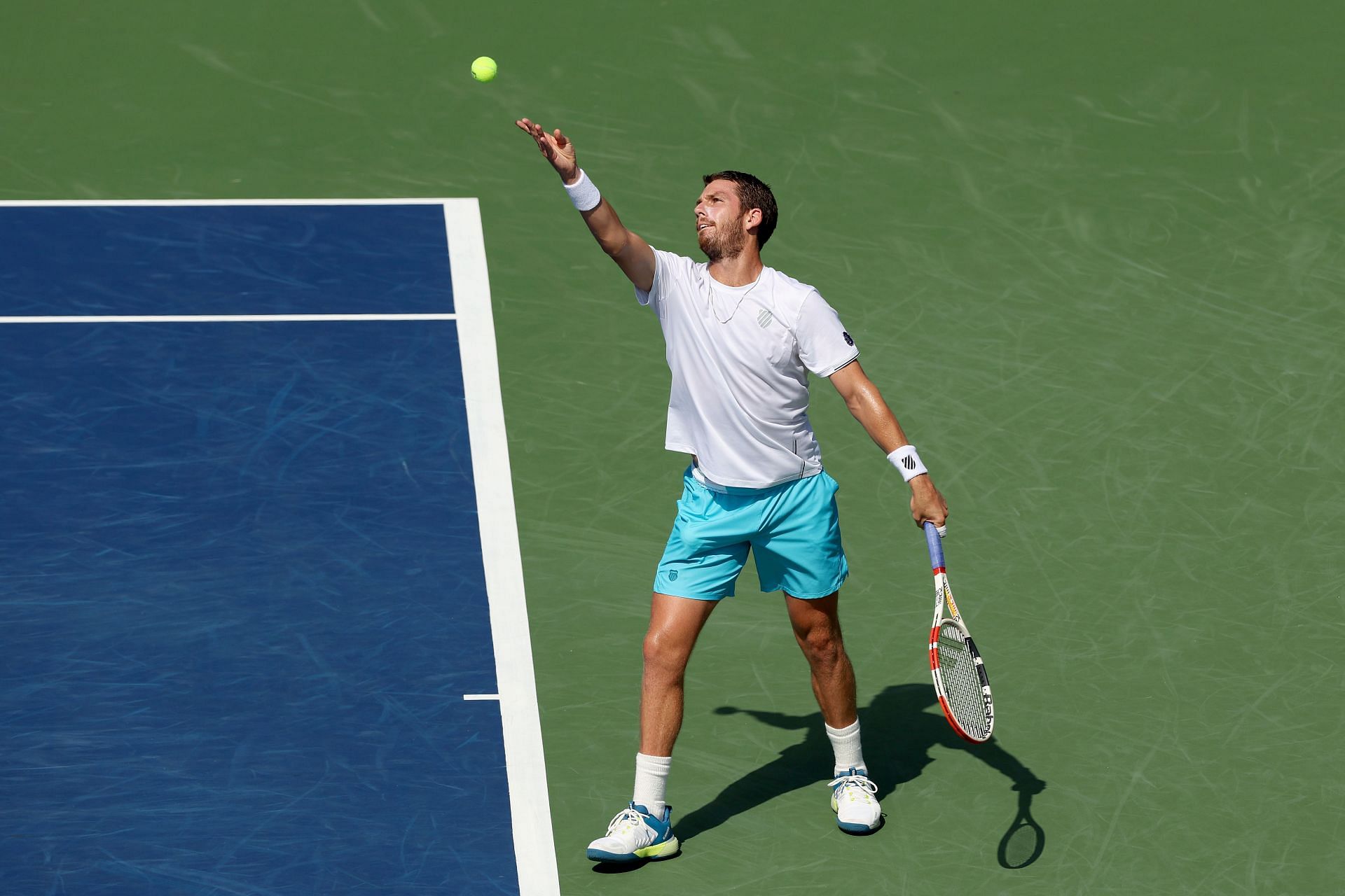 Cameron Norrie of Great Britain serves Andy Murray of Great Britain during the Western & Southern Open 