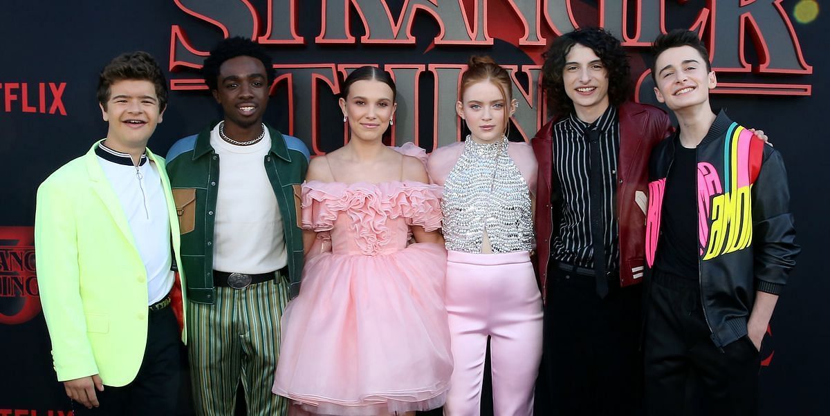 Caleb with his Stranger Things co-stars, Gaten Matarazzo, Millie Bobby Brown, Finn Wolfhard, Noah Schnapp, and Sadie Sink (Image via Getty Images)