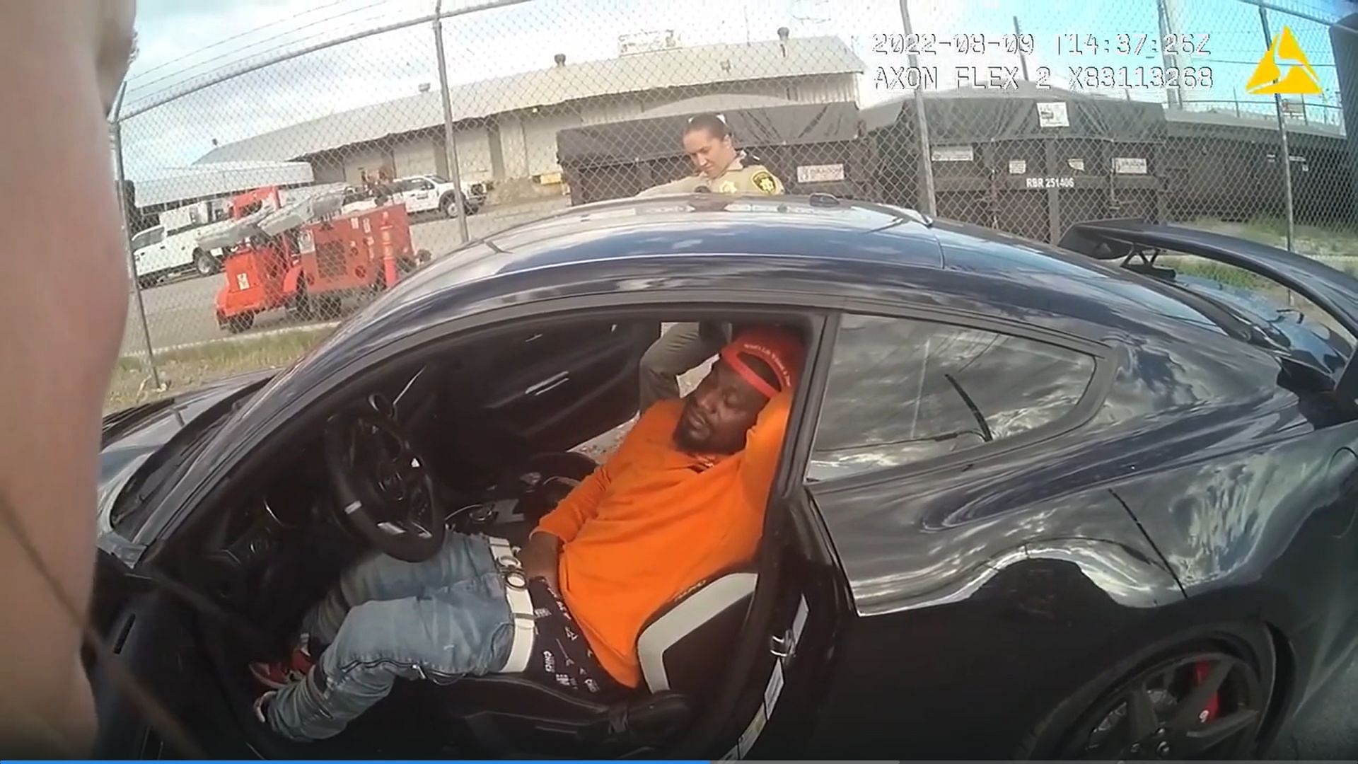 Marshawn Lynch in his car being questioned by police.