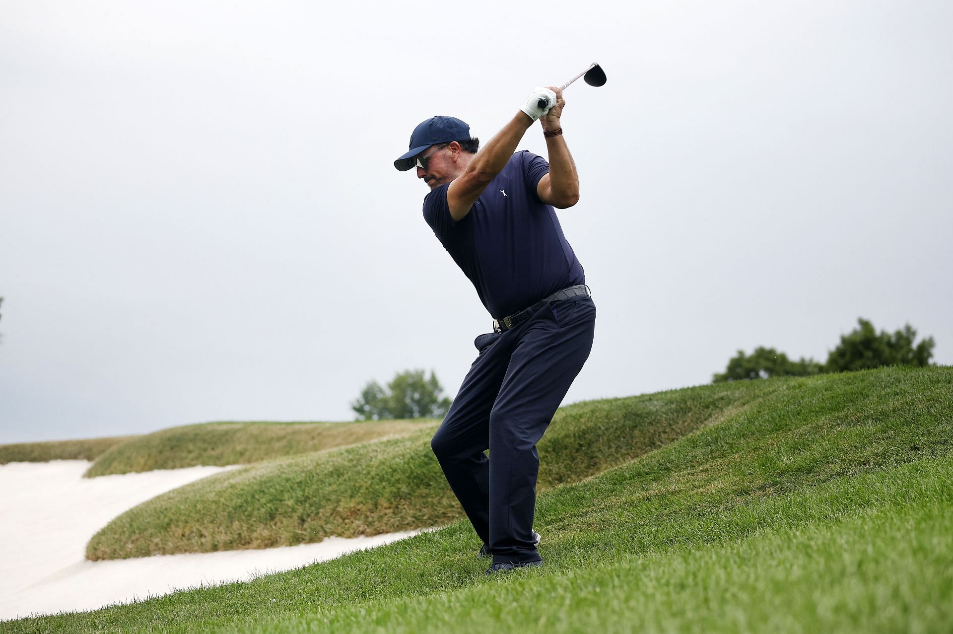 Phil Mickelson of Hy Flyers GC plays his second shot on the 15th hole during the LIV Golf Invitational.