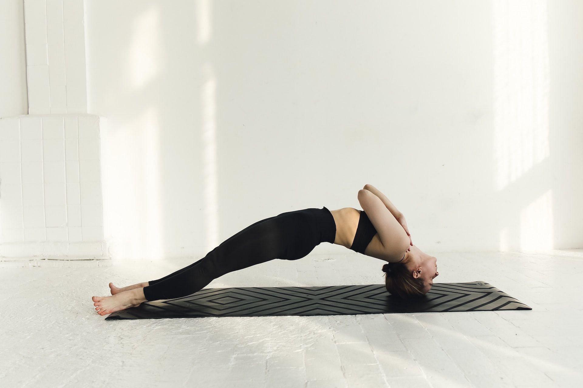 Certain yoga exercises can help reduce back fat. (Photo via Pexels/Photo by Polina Tankilevitch)