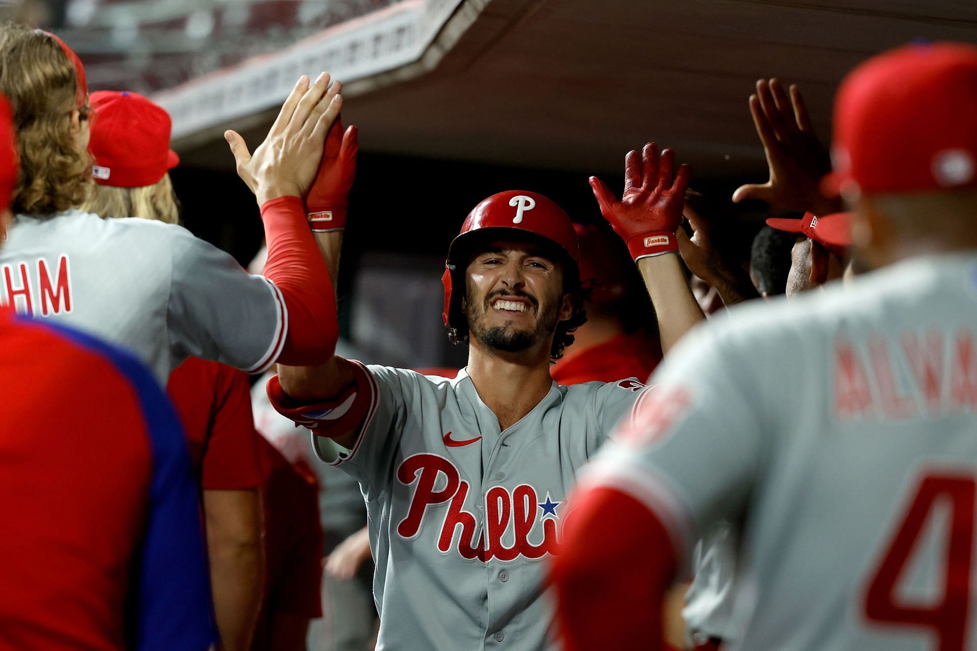 Garrett Stubbs celebrates with teammates after hitting a three-run home run during an MLB Philadelphia Phillies v Cincinnati Reds game.