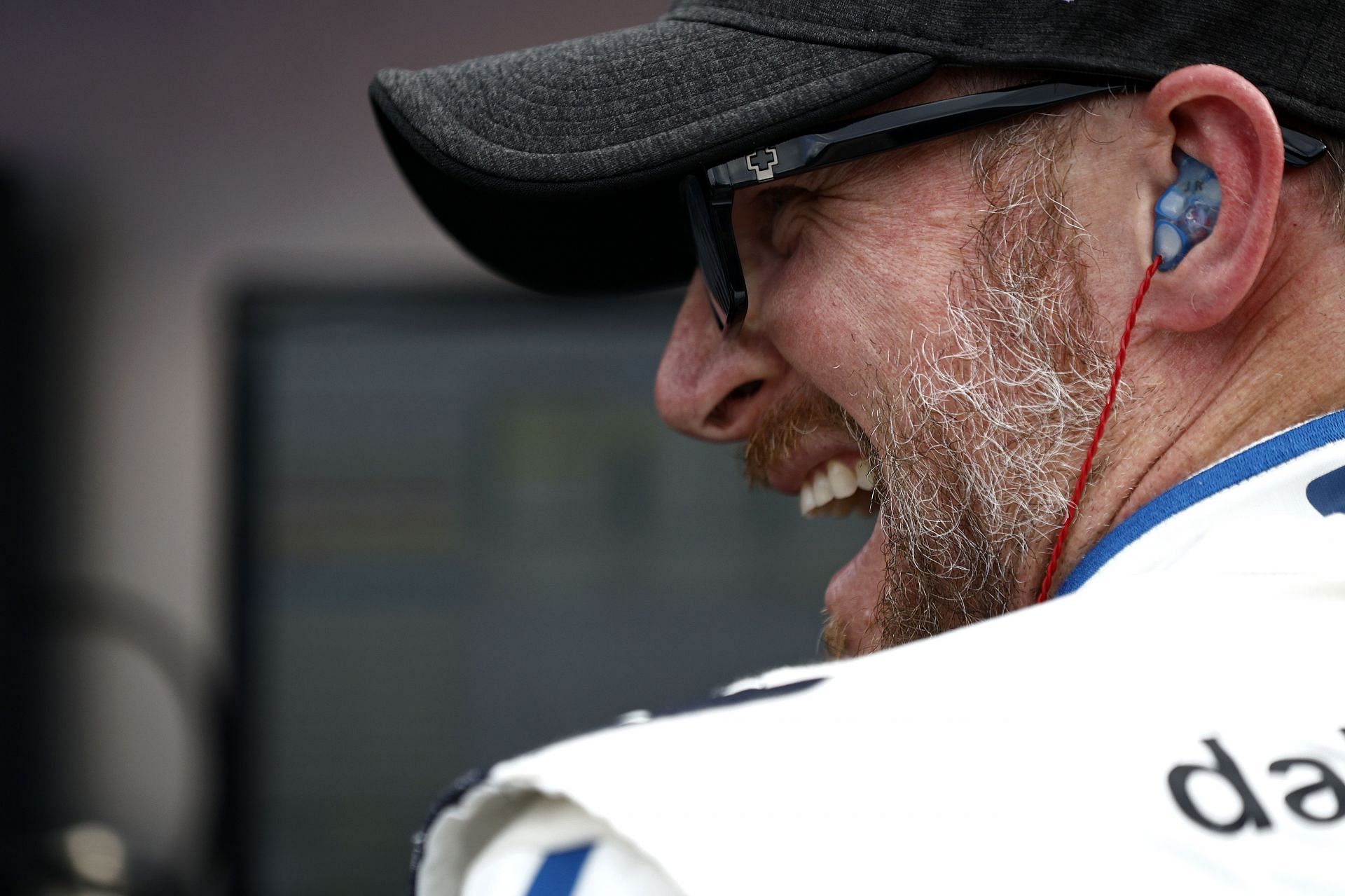 Dale Earnhardt Jr. laughs on the grid during qualifying for the NASCAR Xfinity Series Call 811 Before You Dig 250 powered by Call 811.com at Martinsville Speedway
