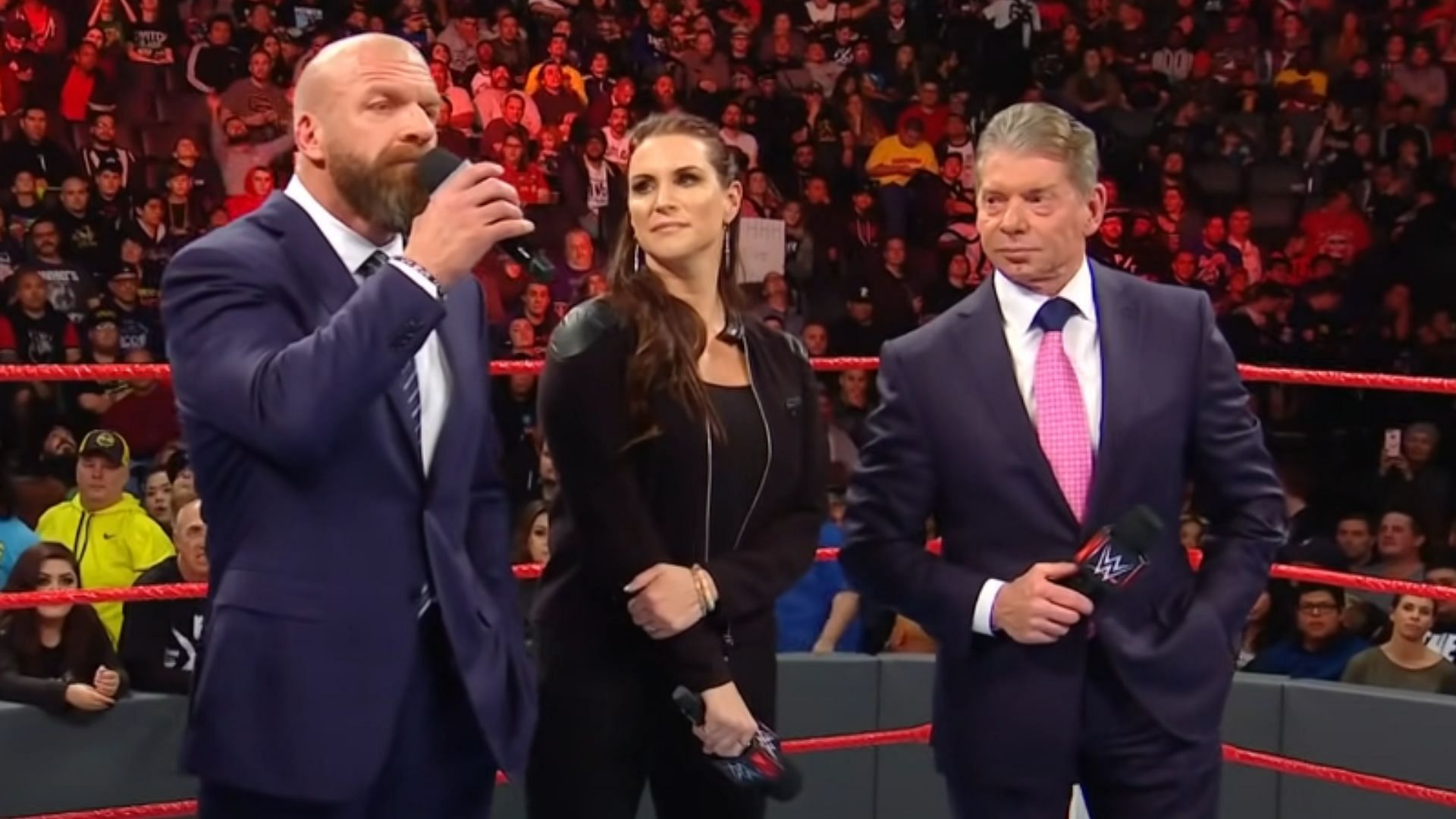 Left to right: Triple H, Stephanie McMahon, and Vince McMahon.
