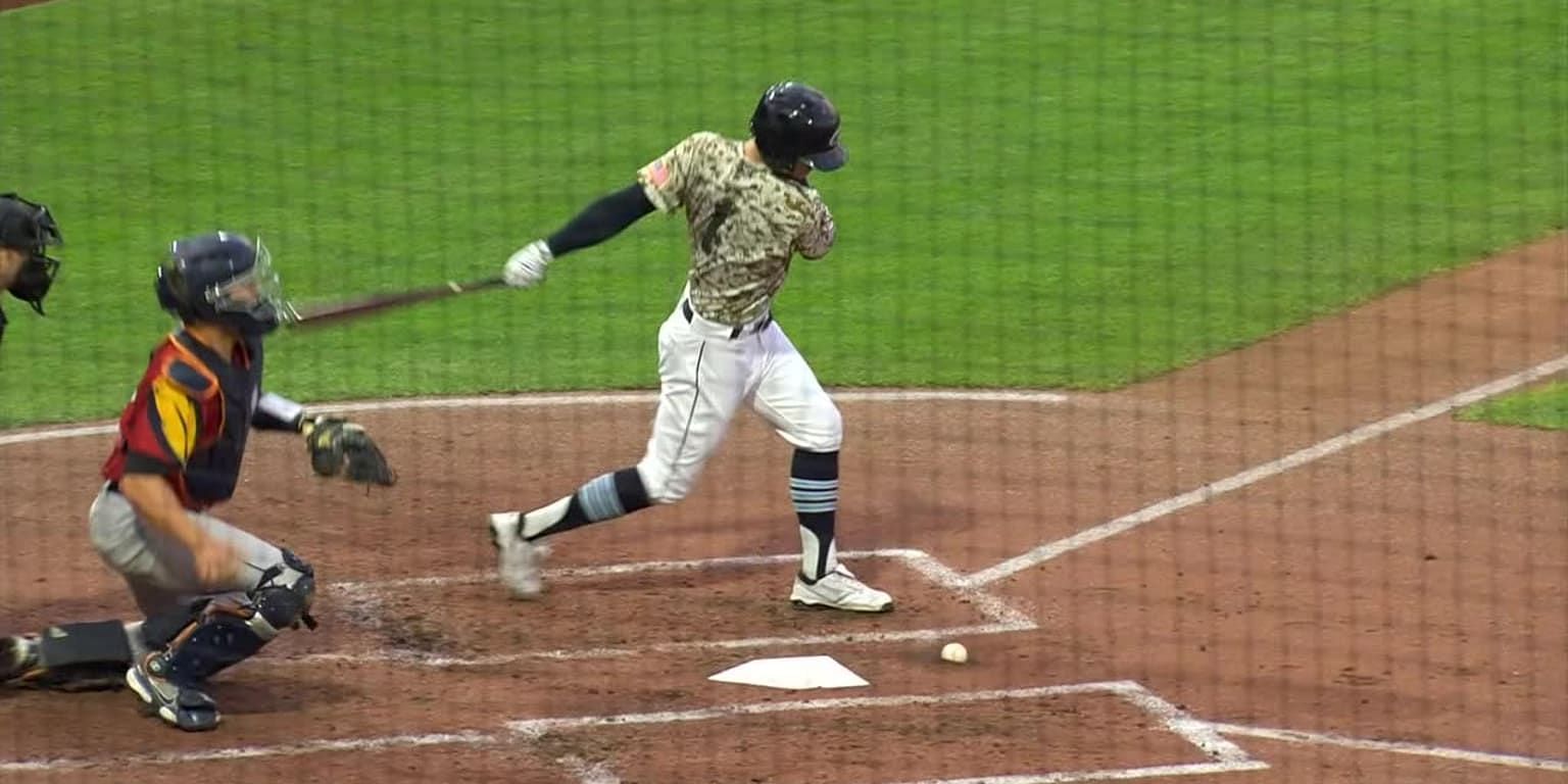 Ernie Clement hits a ground ball that remains stuck in front of home plate during a Triple-A contest between the Toledo Mud Hens and Columbus Clippers.