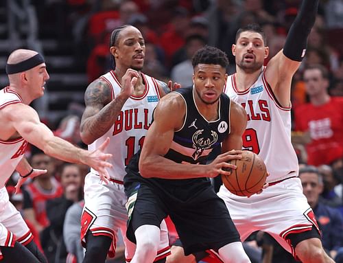 Giannis Antetokounmpo guarded by Chicago Bulls players in the NBA playoffs.