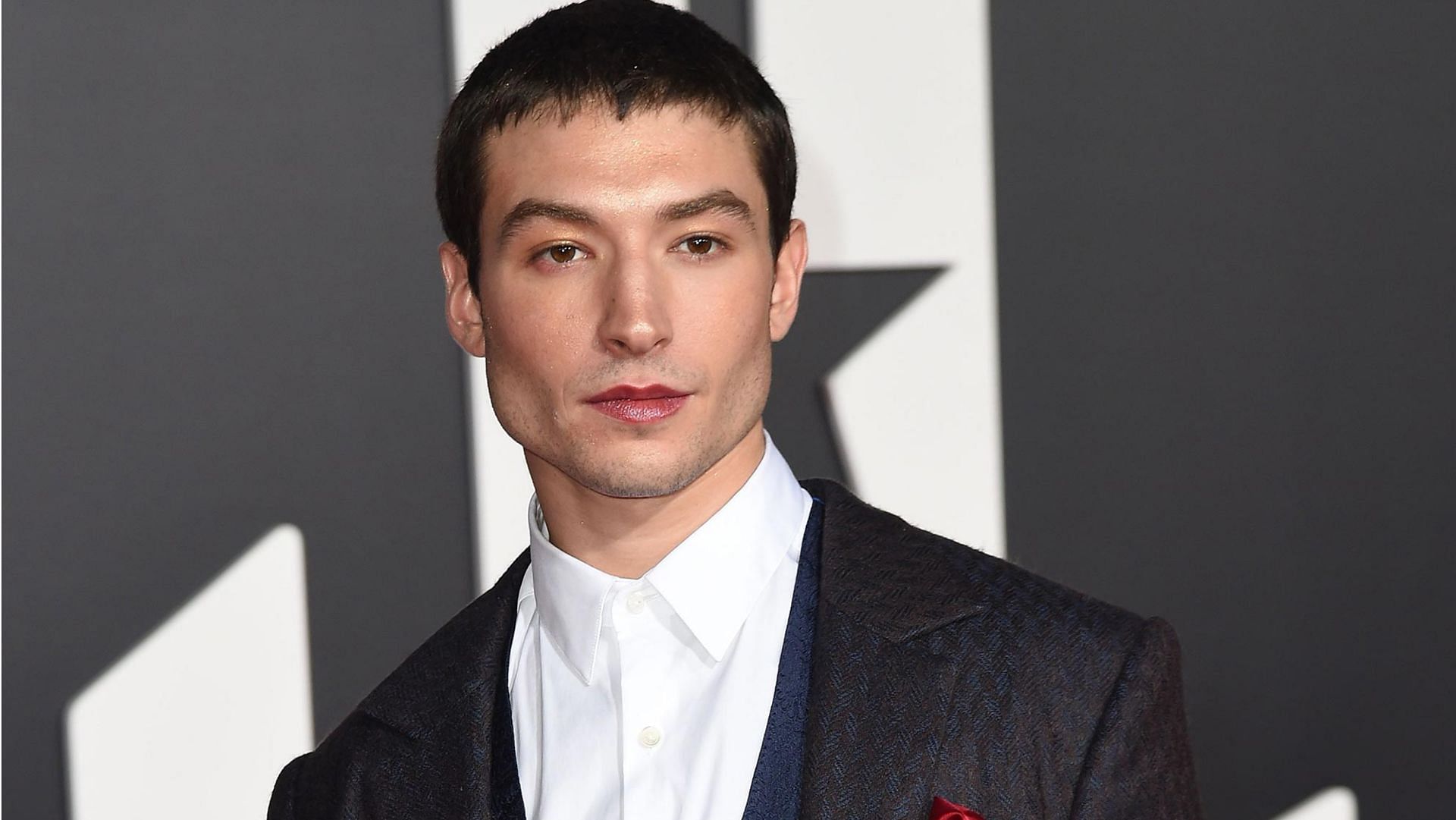 Ezra Miller has apologized for their off-screen behavior for the past two years. (Image via AFP/ Getty Images)