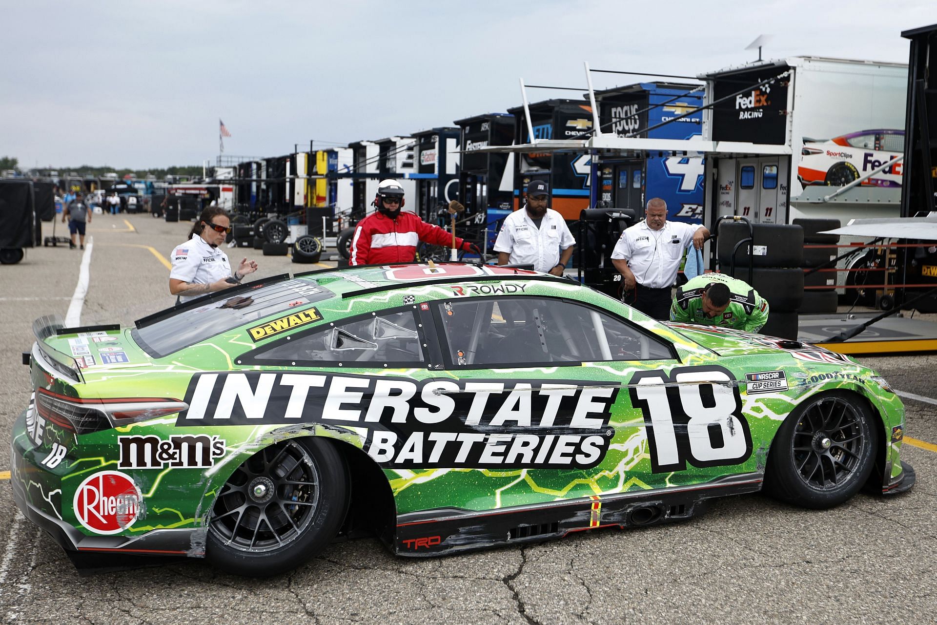 The #18 Interstate Batteries Toyota, driven by Kyle Busch sits in the garage area after an on-track incident during the NASCAR Cup Series FireKeepers Casino 400 at Michigan International Speedway