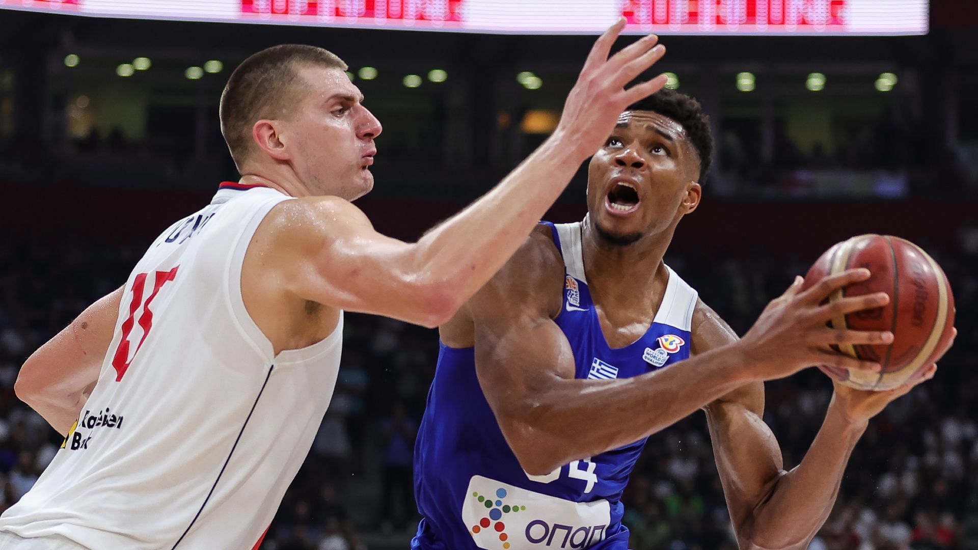Nikola Jokic and Giannis Antetokounmpo in action during a World Cup qualifier game [Photo via NBA.com]