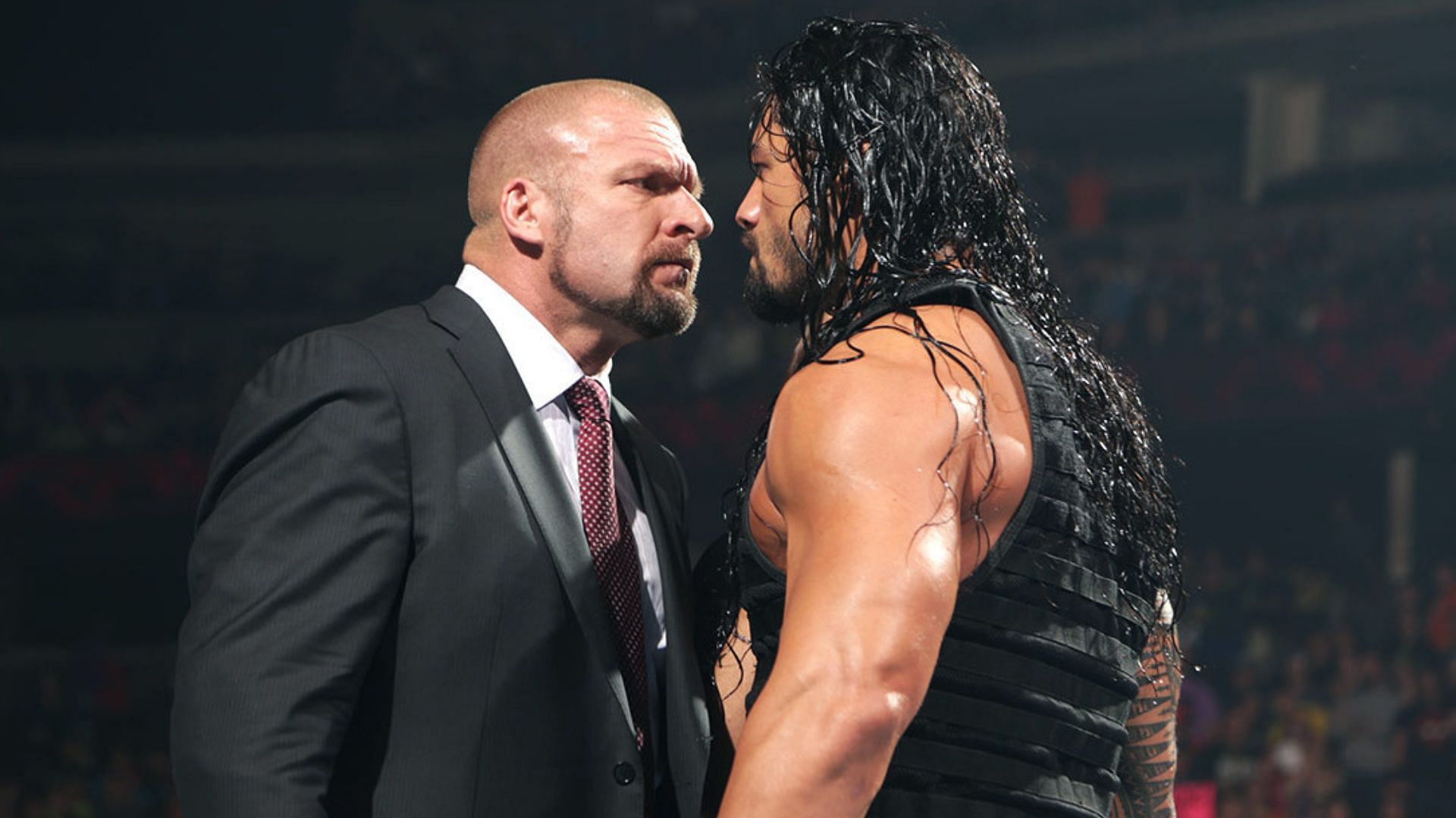 Triple H (left) and Roman Reigns (right)