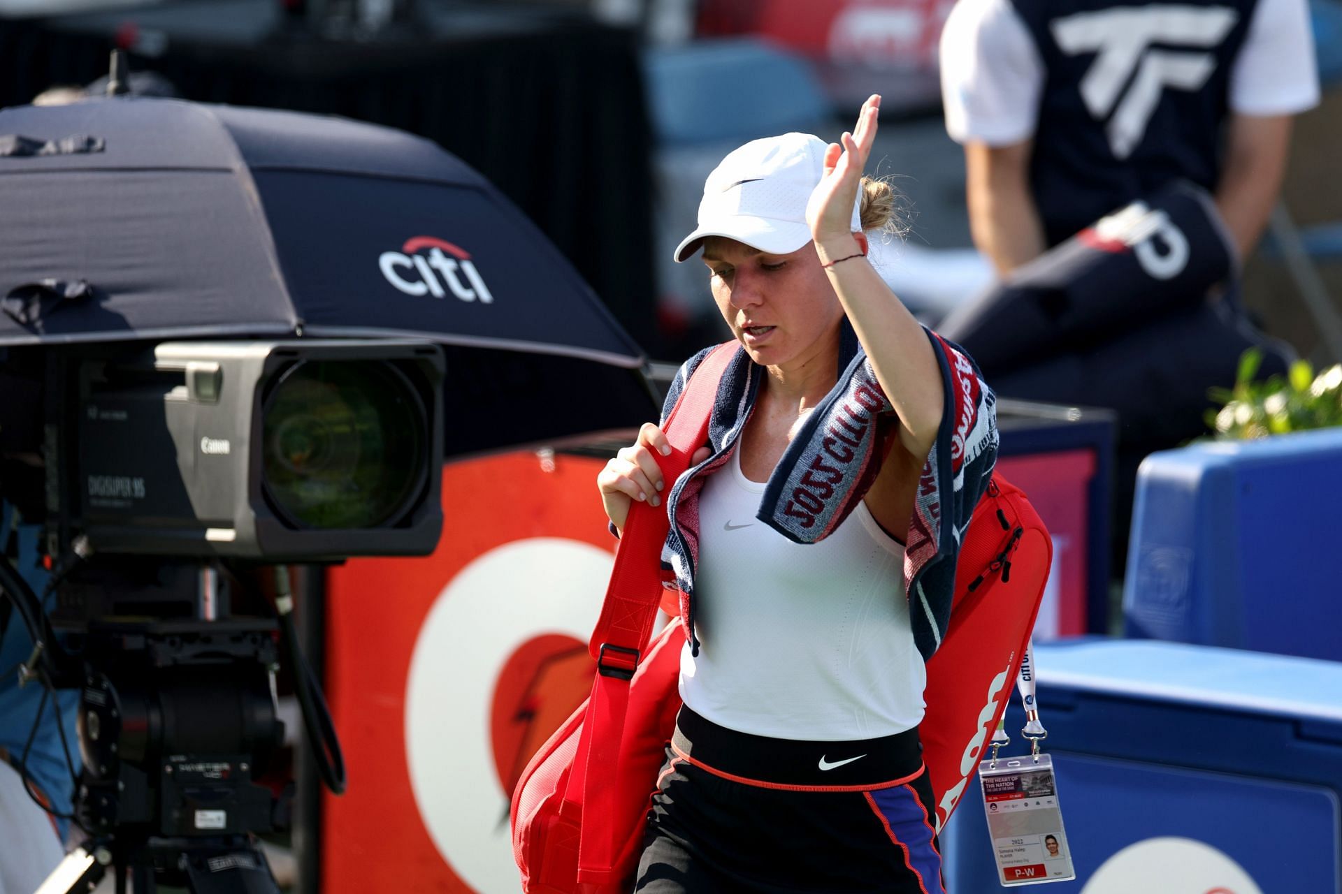 Simona Halep waves to the crowd after retiring from her second-round match against Anna Kalinskaya in Washington.