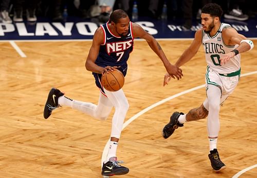 Brooklyn Nets forward Kevin Durant drives against Boston Celtics forward Jayson Tatum.