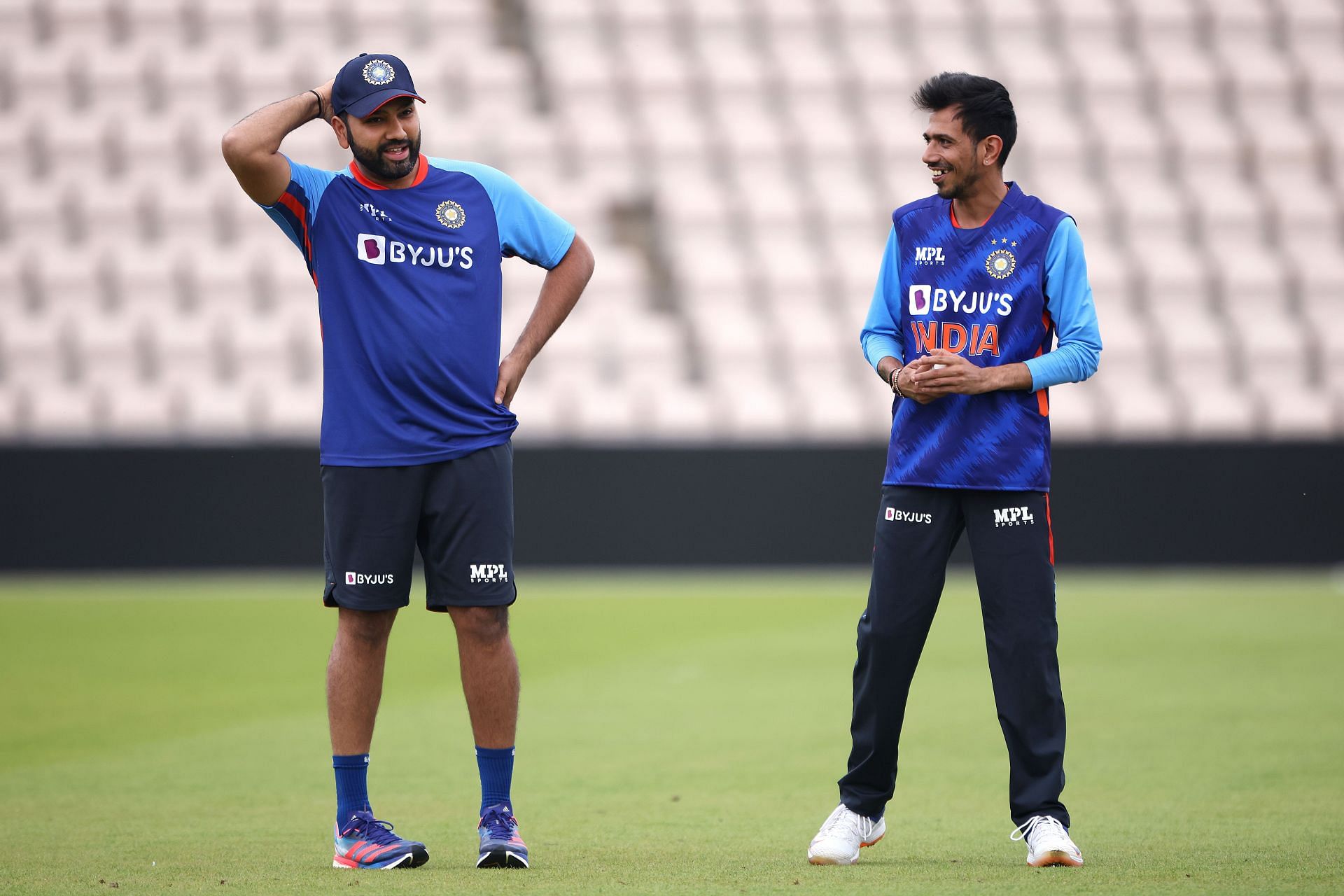 Yuzvendra Chahal (right) chats with captain Rohit Sharma. Pic: Getty Images