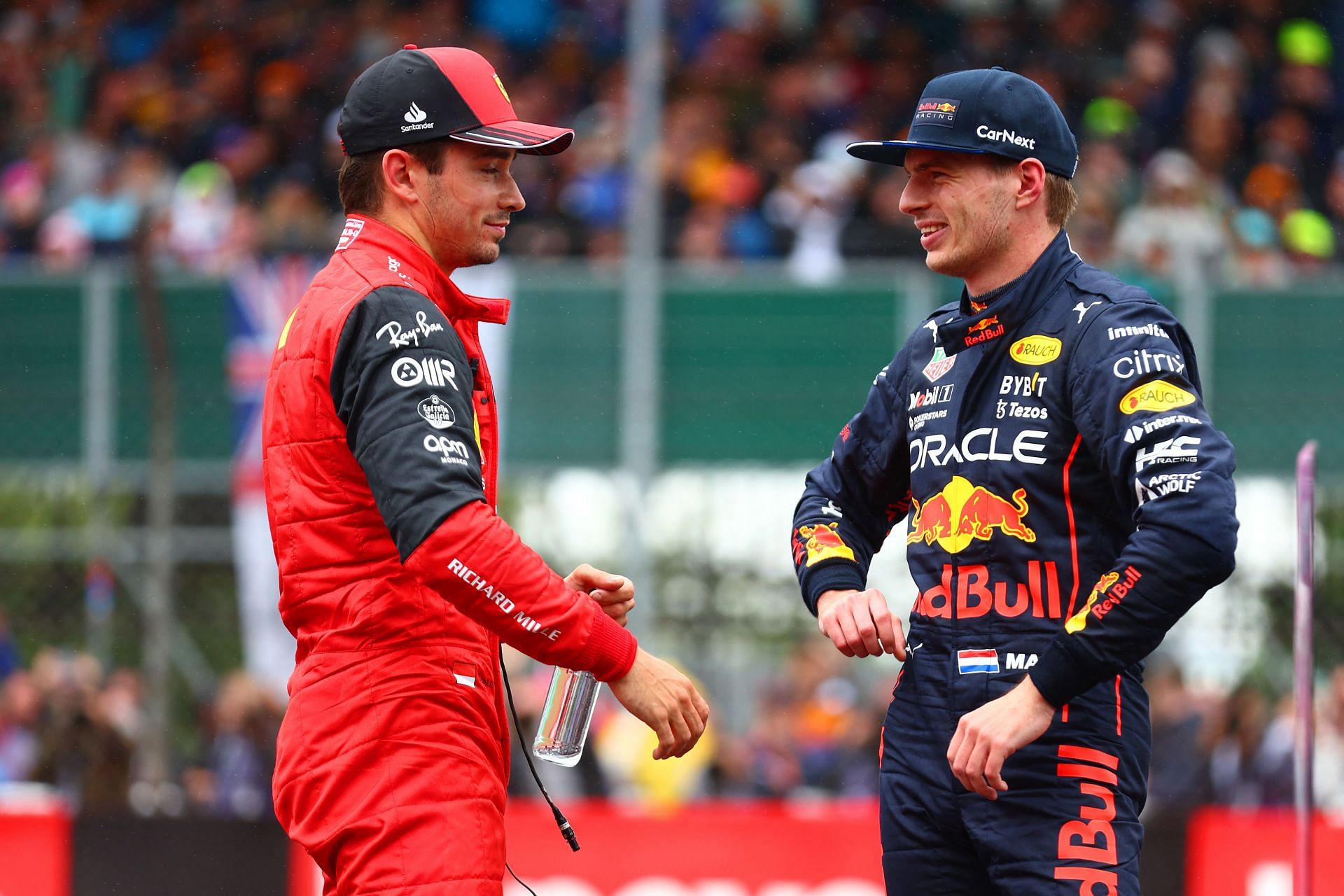 Charles Leclerc and Max Verstappen talk in parc ferme during qualifying ahead of the F1 Grand Prix of Great Britain at Silverstone on July 02, 2022, in Northampton, England (Photo by Mark Thompson/Getty Images)