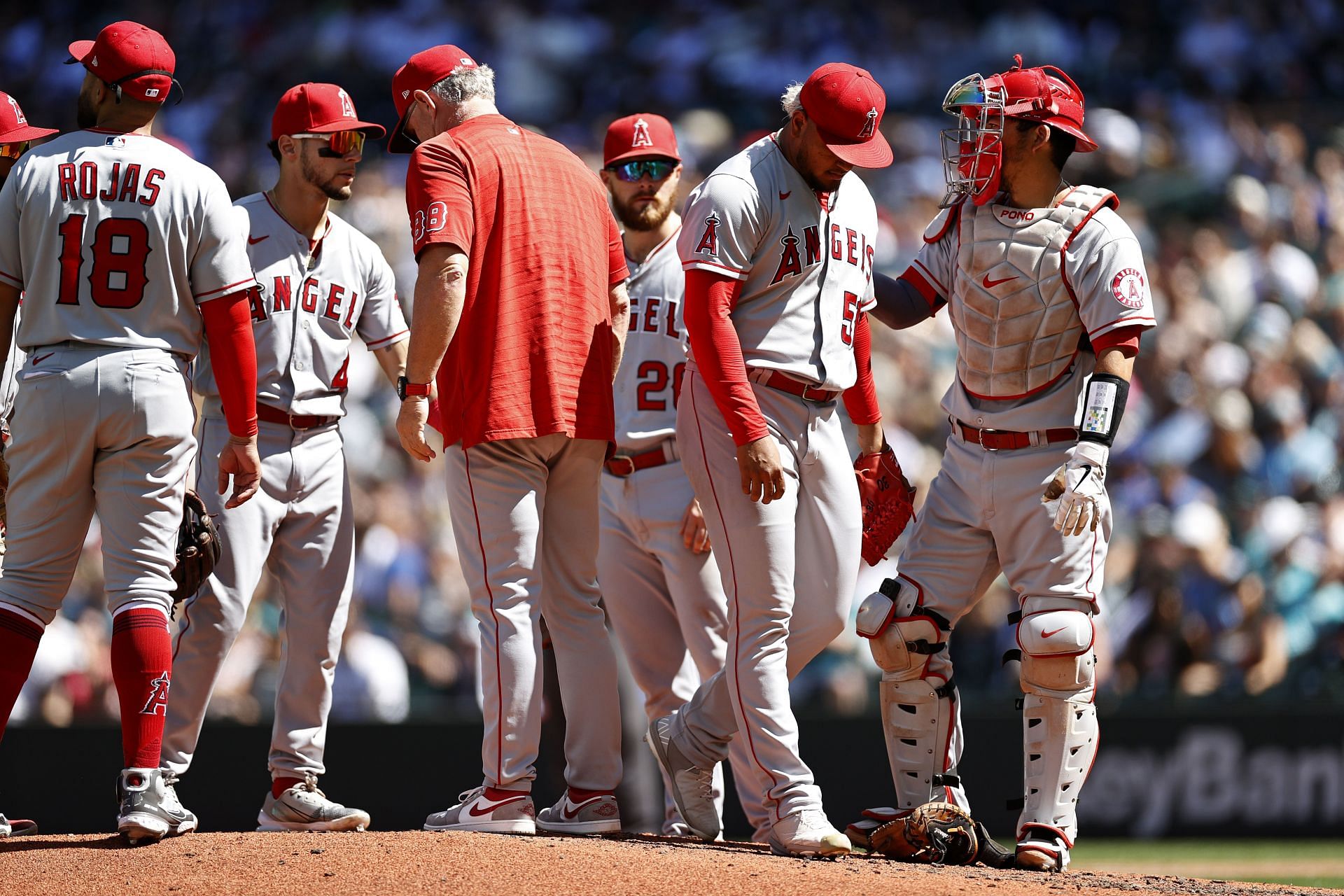 Angels teammates meet during a pitching change during this afernoon&#039;s Los Angeles Angels v Seattle Mariners - Game One