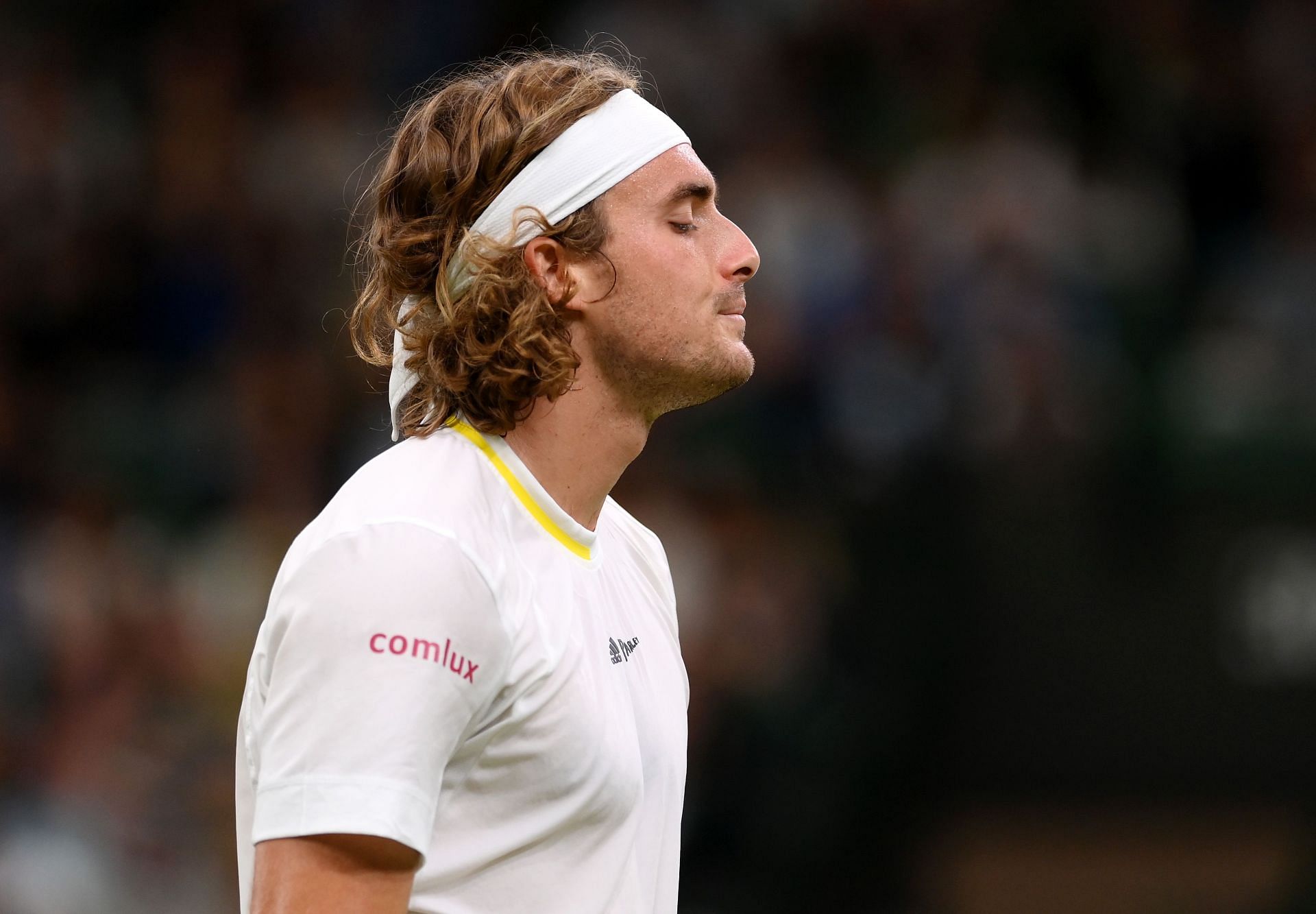 Tsitsipas reacts during his match against Nick Kyrgios at Wimbledon 2022