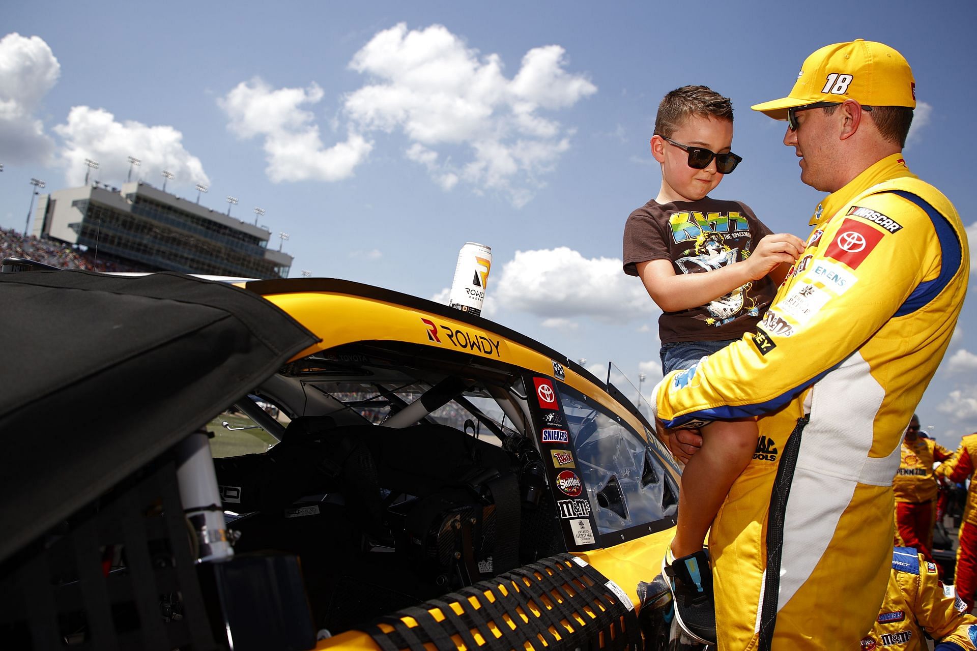 Kyle Busch spend time with his son Brexton on the grid prior to the NASCAR Cup Series Ally 400 at Nashville Superspeedway