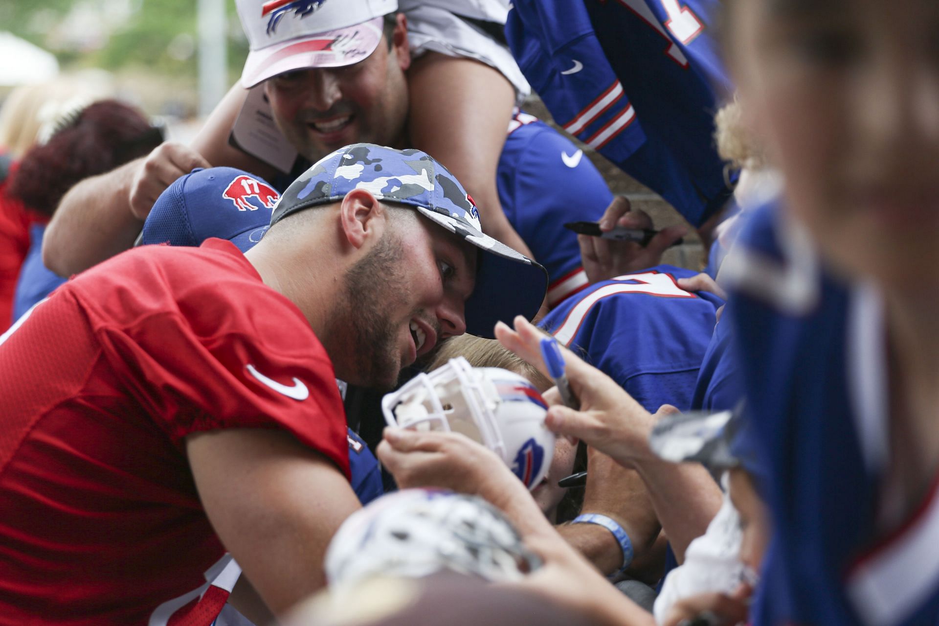 Buffalo Bills quarterback Josh Allen signs autographs for fans during training camp