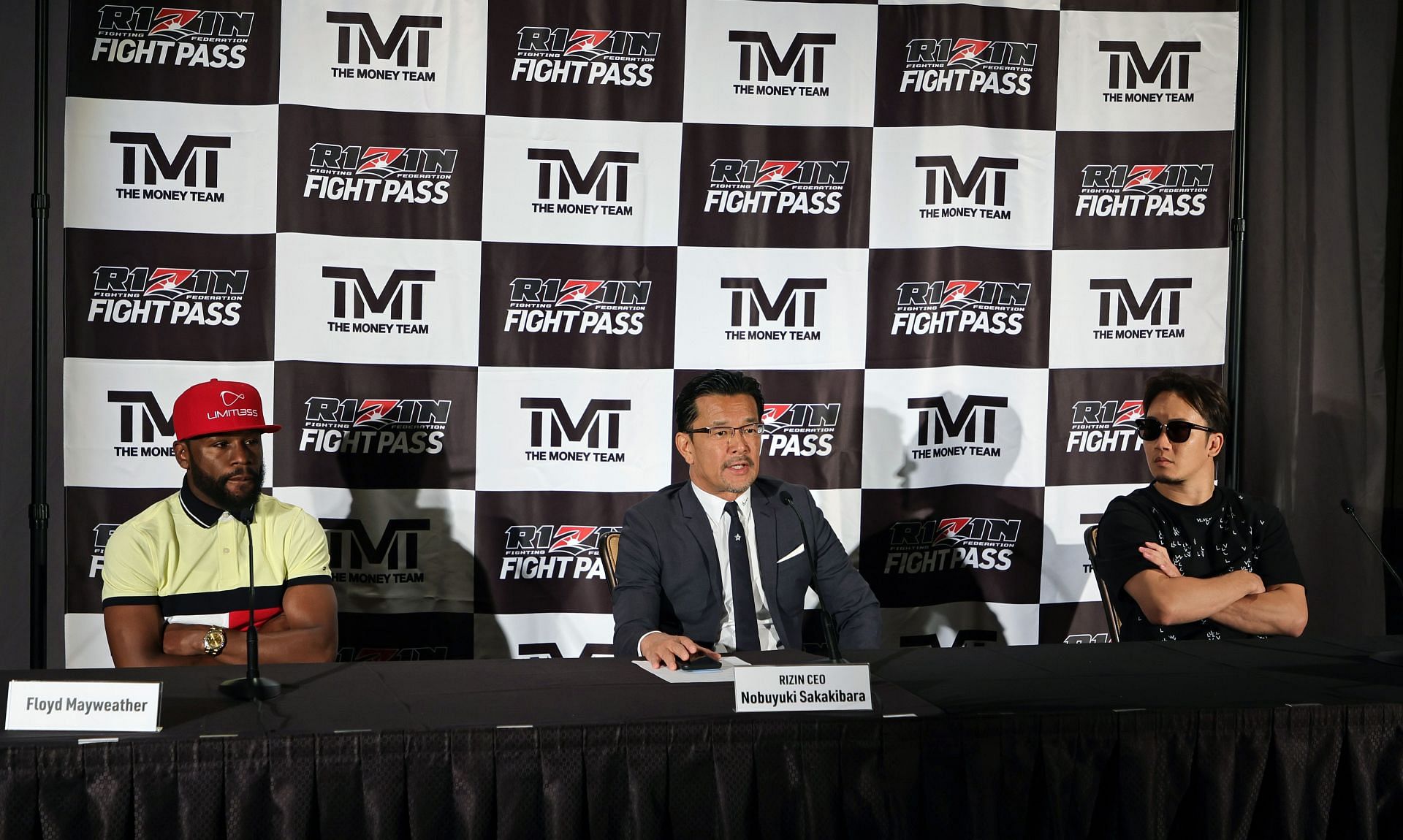 Floyd Mayweather Jr. (L) announces an exhibition fight against Mikuru Asakura (R)