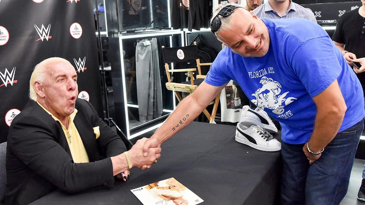 Ric Flair is seen greeting fans from his time in WWE