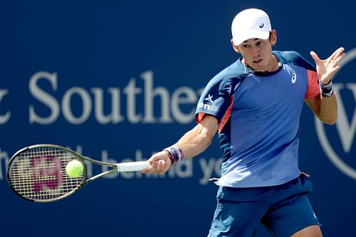  Alex de Minaur returns a shot at the Western & Southern Open - Day 5