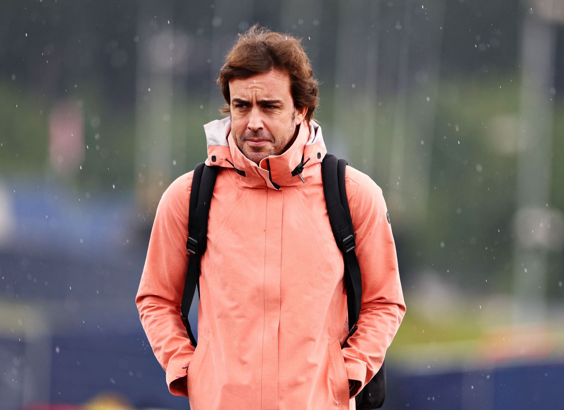 Fernando Alonso walks in the paddock during the 2022 F1 Austrian GP weekend (Photo by Clive Rose/Getty Images)